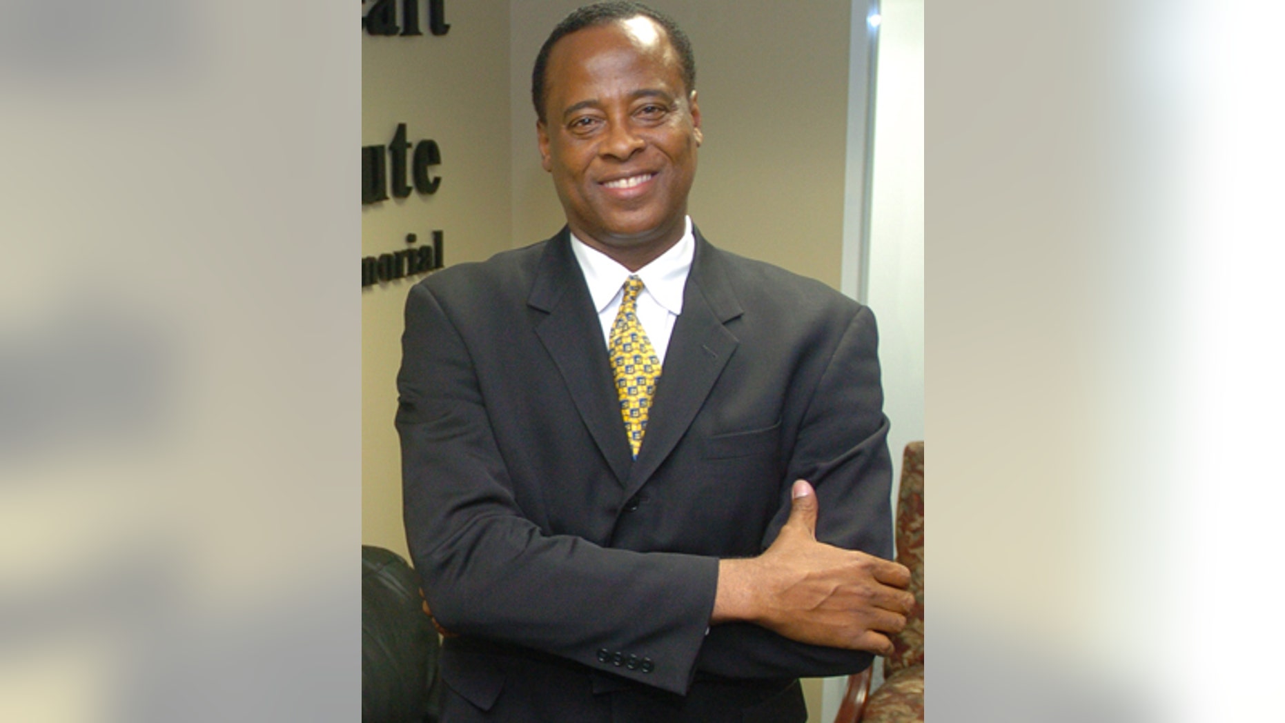 In this July 7, 2006 photo, Dr. Conrad Murray poses for a photo as he opens the Acres Homes Cardiovascular Center at the Tidwell Professional Building, in Houston. A woman who answered the phone Friday, June 26, 2009, at Dr. Conrad C. Murray's clinic in Houston confirmed to The Associated Press that Murray was Michael Jackson's cardiologist. Los Angeles police say they want to speak to the doctor but stressed he was not under criminal investigation. (AP Photo/Houston Chronicle)