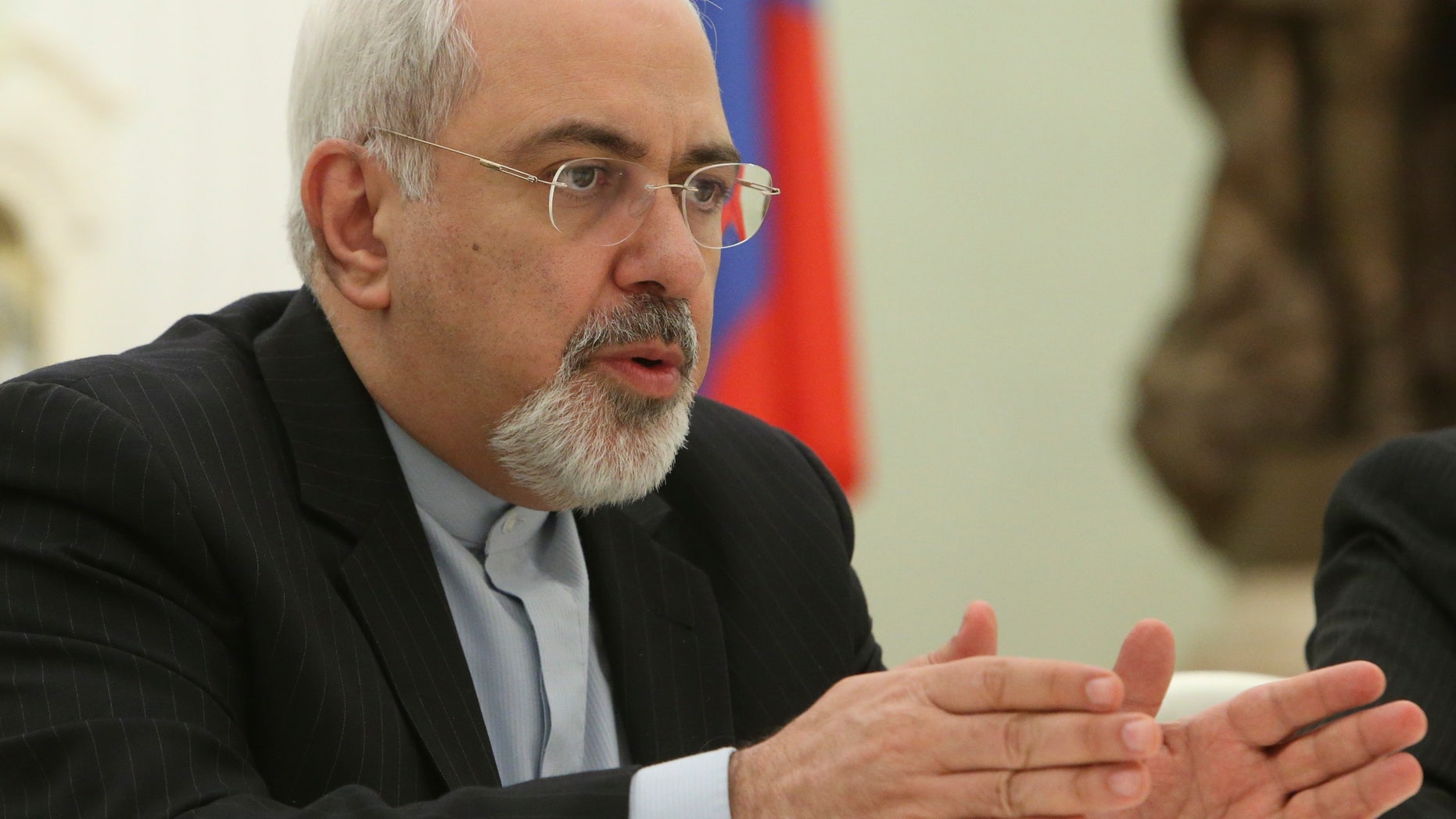 Iranian Foreign Minister Mohammad Javad Zarif speaks at his meeting with Russian President Vladimir Putin in the Kremlin in Moscow, Russia, Thursday, Jan. 16, 2014. Putin credited Tehran for the success of international talks on the Iranian nuclear program and called for boosting Russian-Iranian trade. (AP Photo/Sergei Karpukhin, Pool)