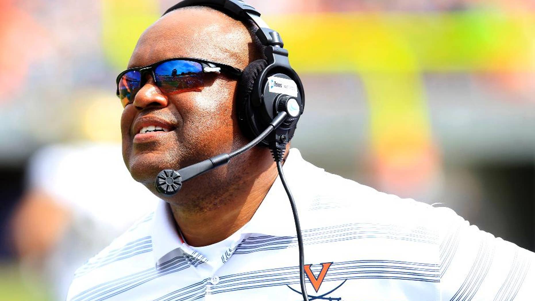 Virginia head coach Mike London up during the second half of an NCAA college football game against UCLA at Scott Stadium, Saturday, Aug. 30, 2014, in Charlottesville, Va. UCLA won 28-20. (AP Photo/Andrew Shurtleff)