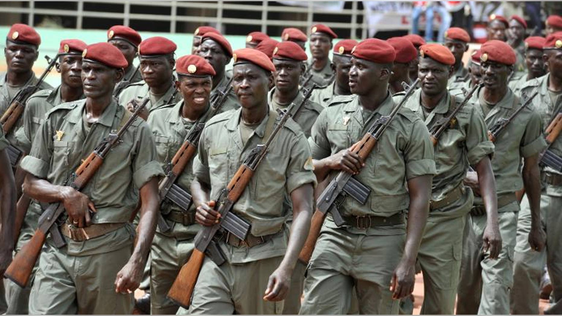 Army forces march during the inauguration of Mali's new president on September 19, 2013 in Bamako