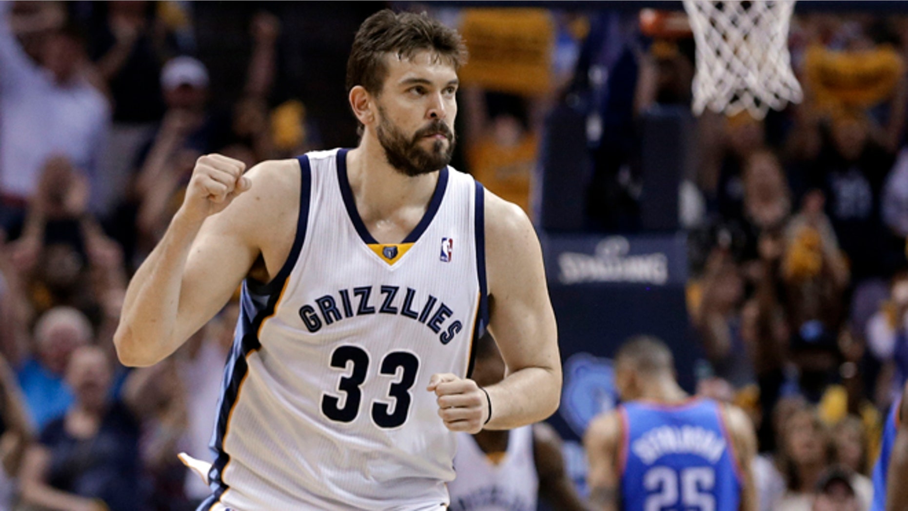 FILE - In this April 24, 2014, file photo, Memphis Grizzlies center Marc Gasol celebrates after scoring against the Oklahoma City Thunder in overtime of Game 3 of an opening-round NBA basketball playoff series in Memphis, Tenn. Marc Gasol has confirmed that he will sign a new five-year contract with the Memphis Grizzlies. The 30-year-old free agent tells Spanish media he will stay at Memphis, as The Associated Press reported on Monday, July 6, 2015. The deal is expected to be worth more than 100 million dollars. (AP Photo/Mark Humphrey, File)
