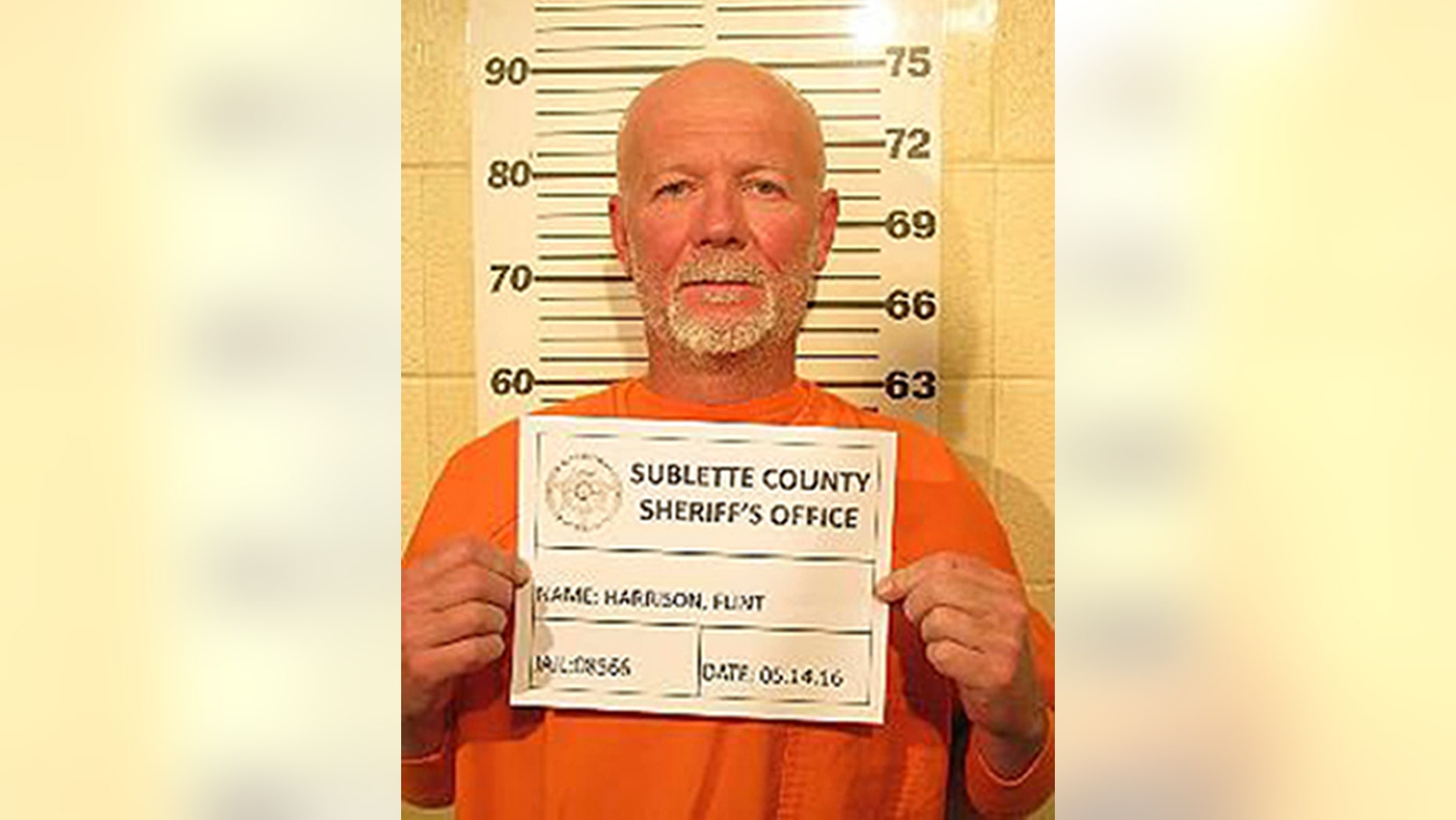 This May 14, 2016, photo provided by the Sublette County Sheriff's Office shows Flint Wayne Harrison. Officers culminated a manhunt late Saturday night with the arrest of Dereck James "DJ" Harrison, 22, several hours after the surrender of his father, Flint Wayne Harrison, 51, the Sublette County Sheriff's Office said. A woman and her four teenage daughters who were lured to a Utah house and tied up in the basement were thrilled and relieved to learn the father and son charged in the bizarre attack were in custody in Wyoming, authorities said Sunday. (Sublette County Sheriff's Office via AP) MANDATORY CREDIT