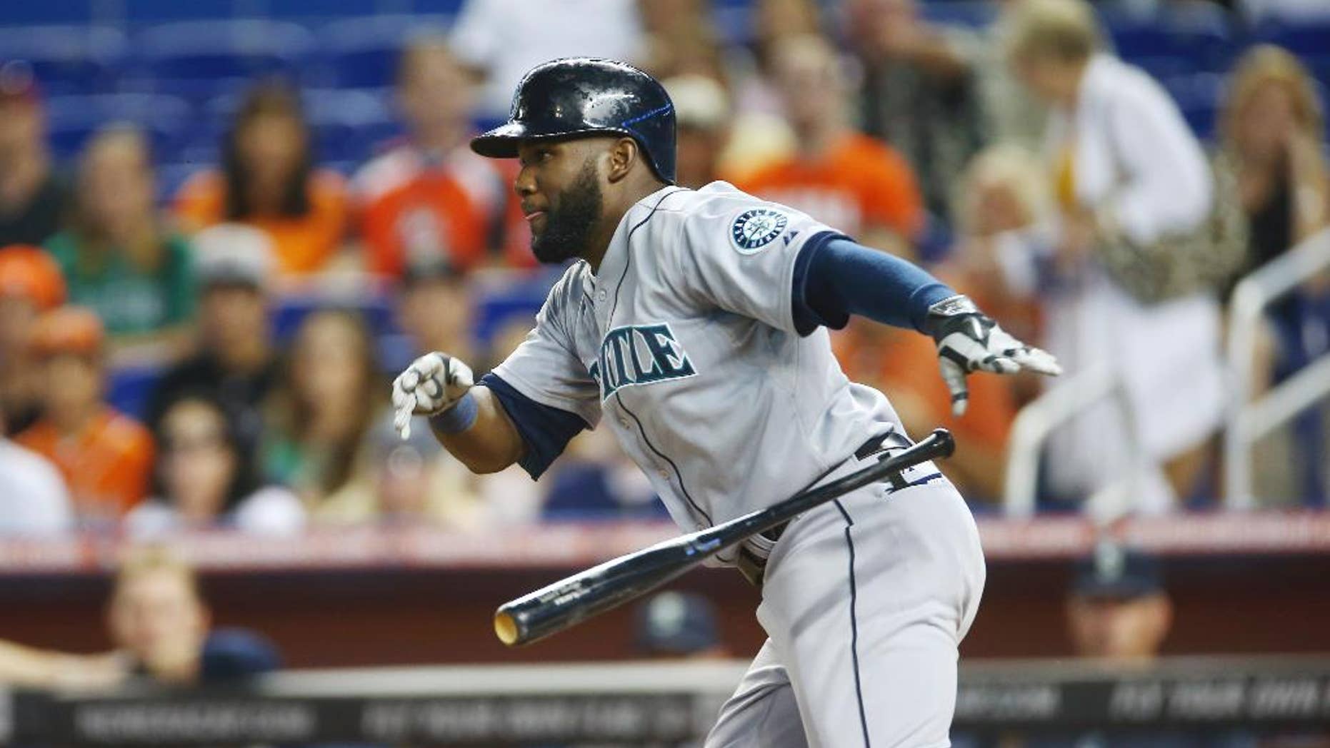 Seattle Mariners' Robinson Cano grounds out during the first inning of a baseball game against the Miami Marlins in Miami, Saturday, April 19, 2014. (AP Photo/J Pat Carter)