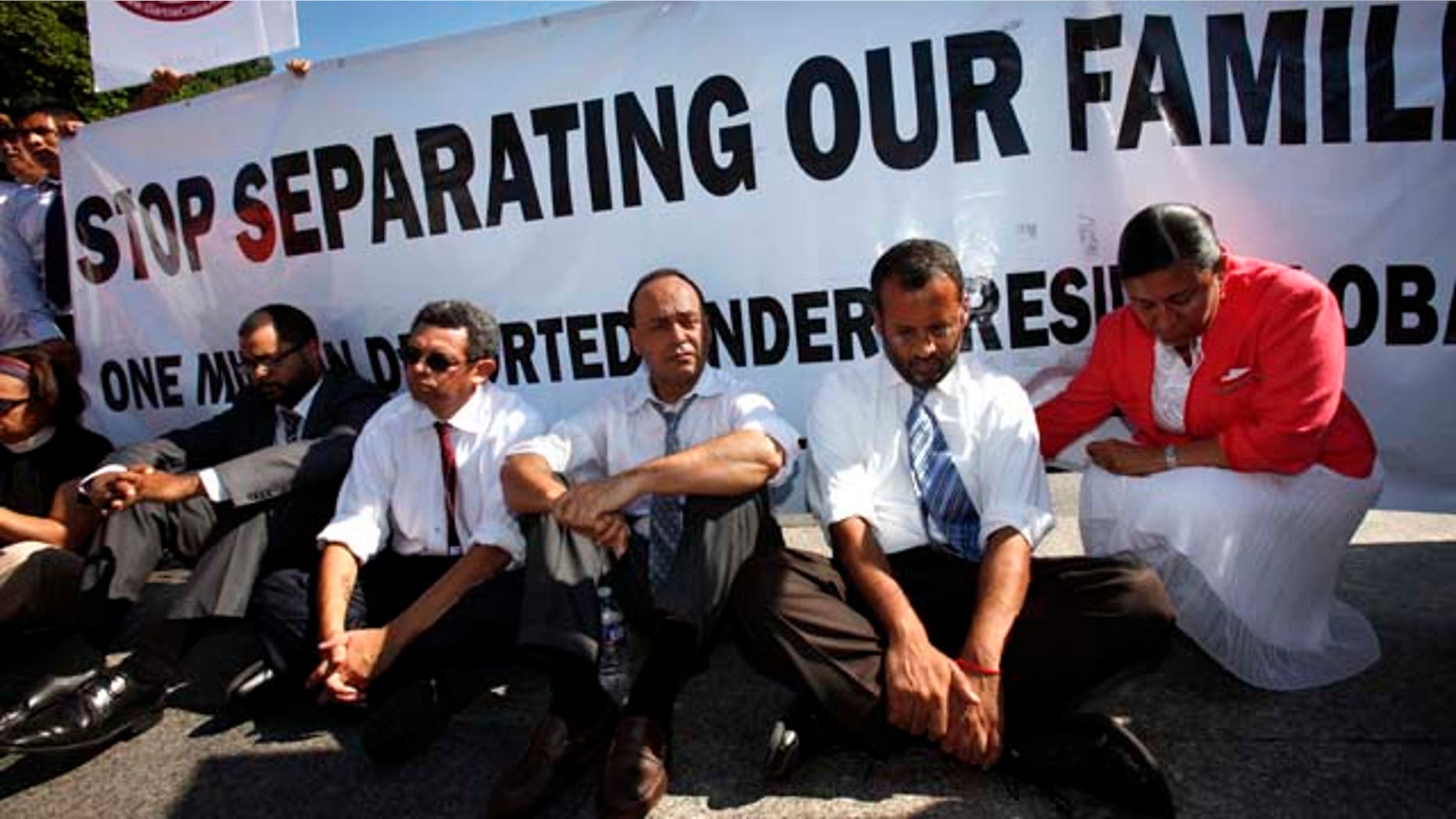 Supporters, including Rep. Luis Gutierrez, D-Ill., third from right, participate in an act of civil disobedience at a rally in 2011 for immigration reform and a pathway to legalization for undocumented immigrants.