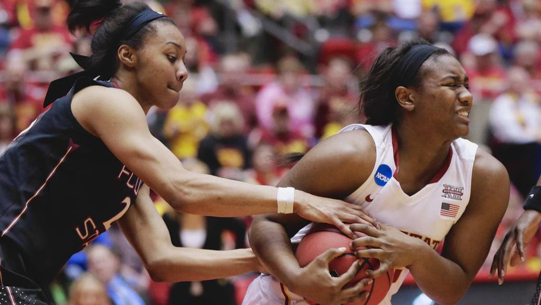 Florida State's Ivey Slaughter, left, and Iowa State's Fallon Ellis (32) struggle for the ball in the second half of a first-round game in the NCAA women's college basketball tournament in Ames, Iowa, Saturday, March 22, 2014. Florida State won 55-44. (AP Photo/Nati Harnik)