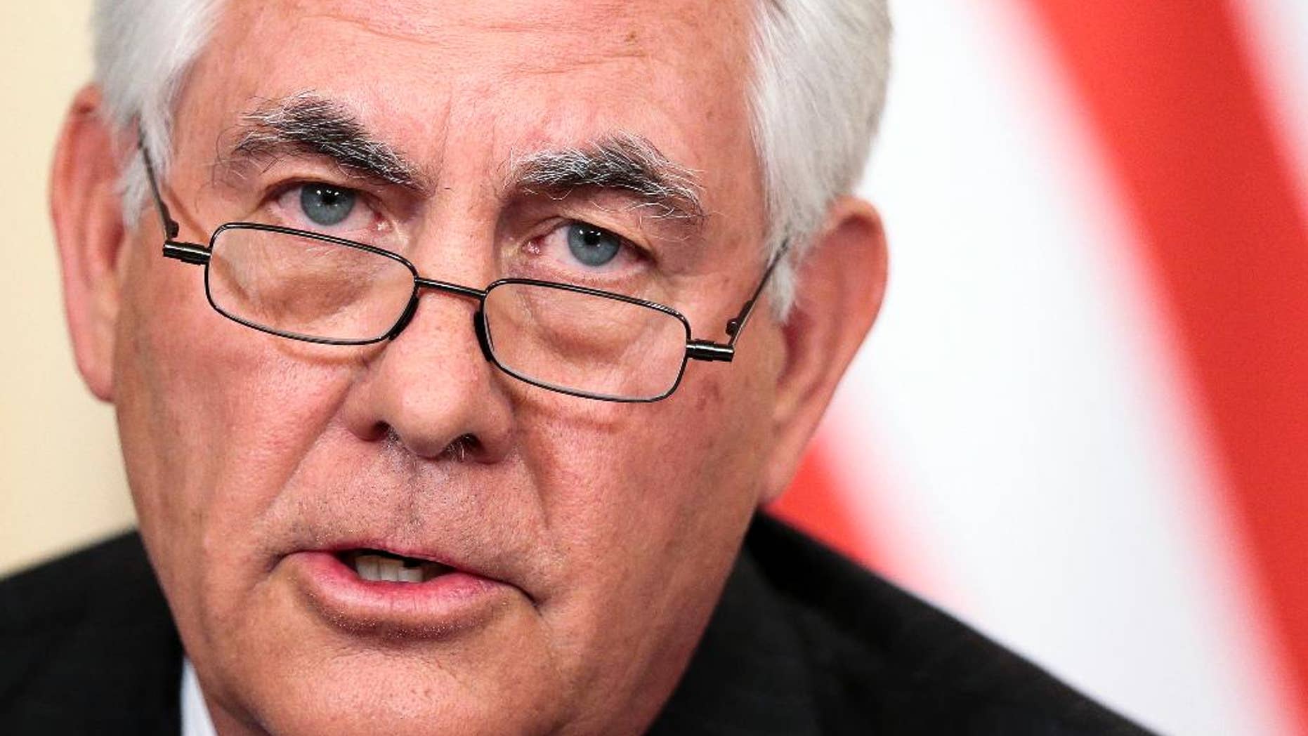 FILE- In this April 12, 2017, file photo, Secretary of State Rex Tillerson speaks to the media during a news conference with Russian Foreign Minister Sergey Lavrov in Moscow. The “America First” president who vowed to extricate America from onerous overseas commitments appears to be warming up to the view that when it comes to global agreements, a deal’s a deal. The administration says it is reviewing these accords and could still pull out of them. A day after certifying Iran’s compliance with the nuclear deal, Tillerson attacked the accord and listed examples of Iran’s bad behavior. His tone suggested that even if Iran is fulfilling the letter of its nuclear commitments, the deal remains on unsure footing.(AP Photo/Ivan Sekretarev, File)
