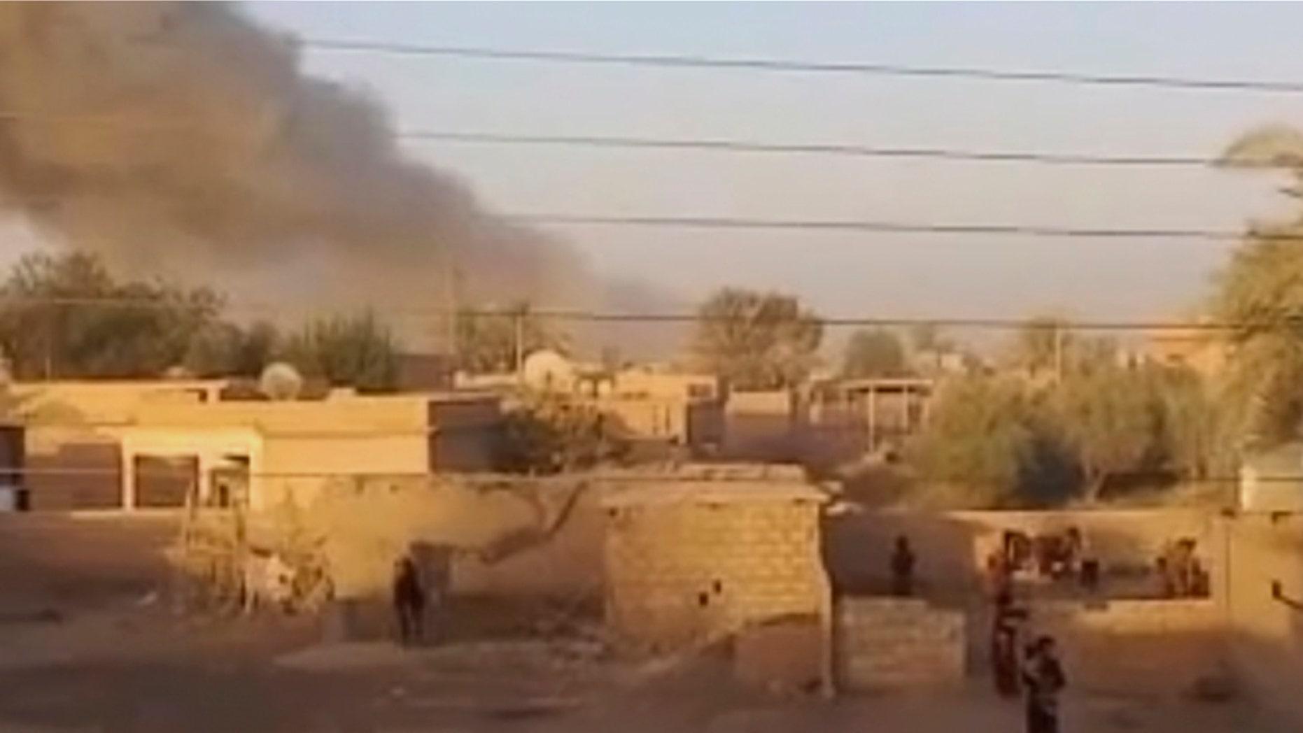 This image made from video provided by Deir Press Network and accessed by AP video on Thursday, Aug. 23, 2012 purports to show smoke rising after a bombing in Deir El-Zour, Syria.