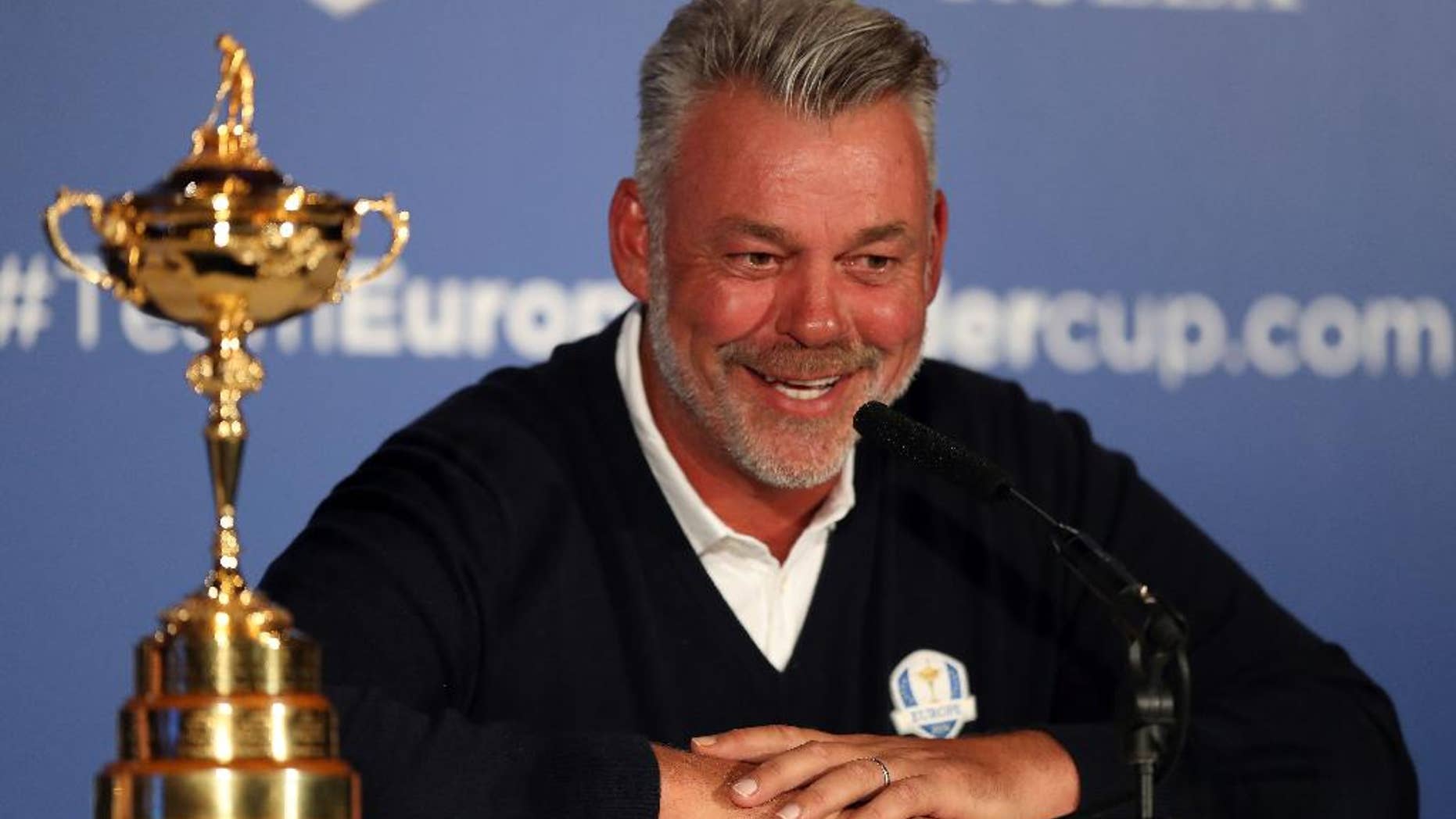 European Ryder Cup captain Darren Clarke smiles during a press conference at Wentworth Golf Club, Virginia Waters, England Tuesday Aug. 30, 2016. Lee Westwood, Martin Kaymer and Thomas Pieters will fill out the European team as Darren Clarke's captain's picks for the Ryder Cup against the United States at Hazeltine from Sept. 30-Oct. 2. Clarke announced his choices at the European Tour's headquarters at Wentworth on Tuesday. (Andrew Matthews/PA via AP)