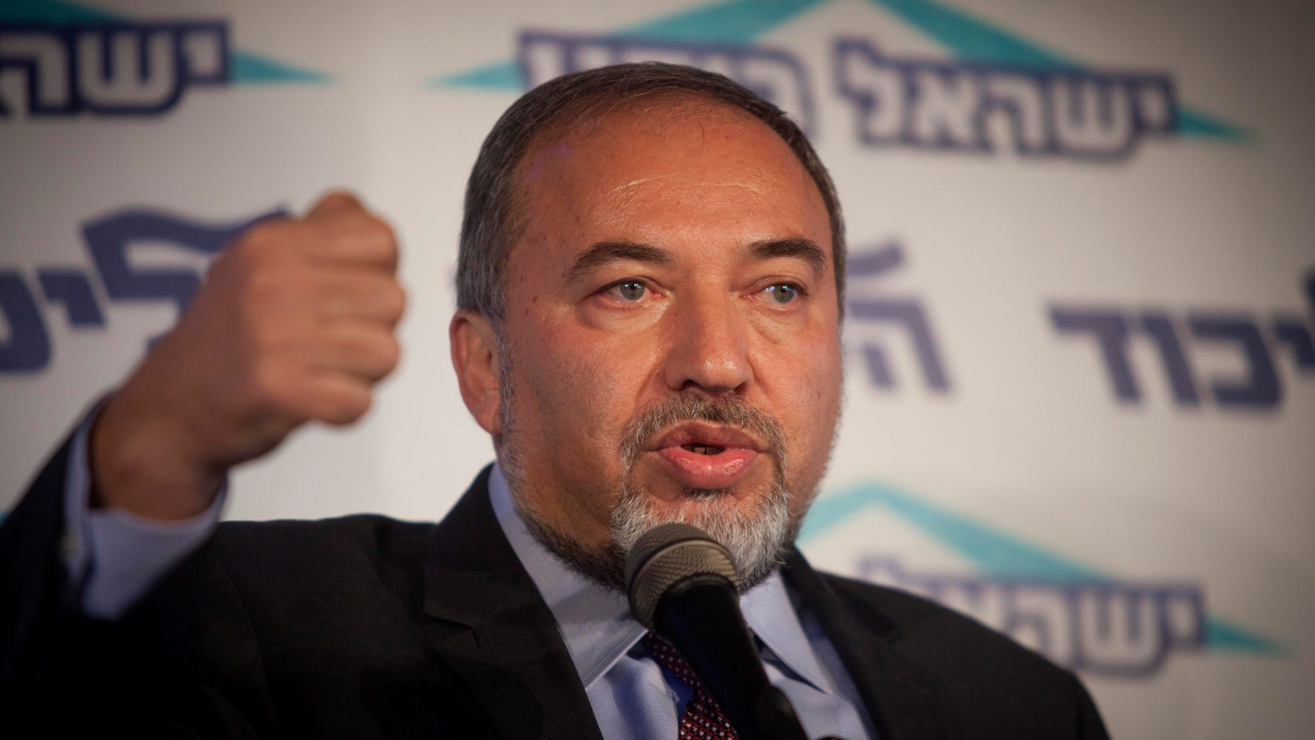 Israel's Foreign Minister Avigdor Lieberman speaks to the media during an event in Tel Aviv, Israel, Thursday, Dec. 13, 2012. Israel’s powerful foreign minister resisted calls to resign after he was charged Thursday with breach of trust for actions that allegedly compromised a criminal investigation into his business dealings, throwing the country's election campaign into disarray just weeks before the vote. (AP Photo/Dan Balilty)