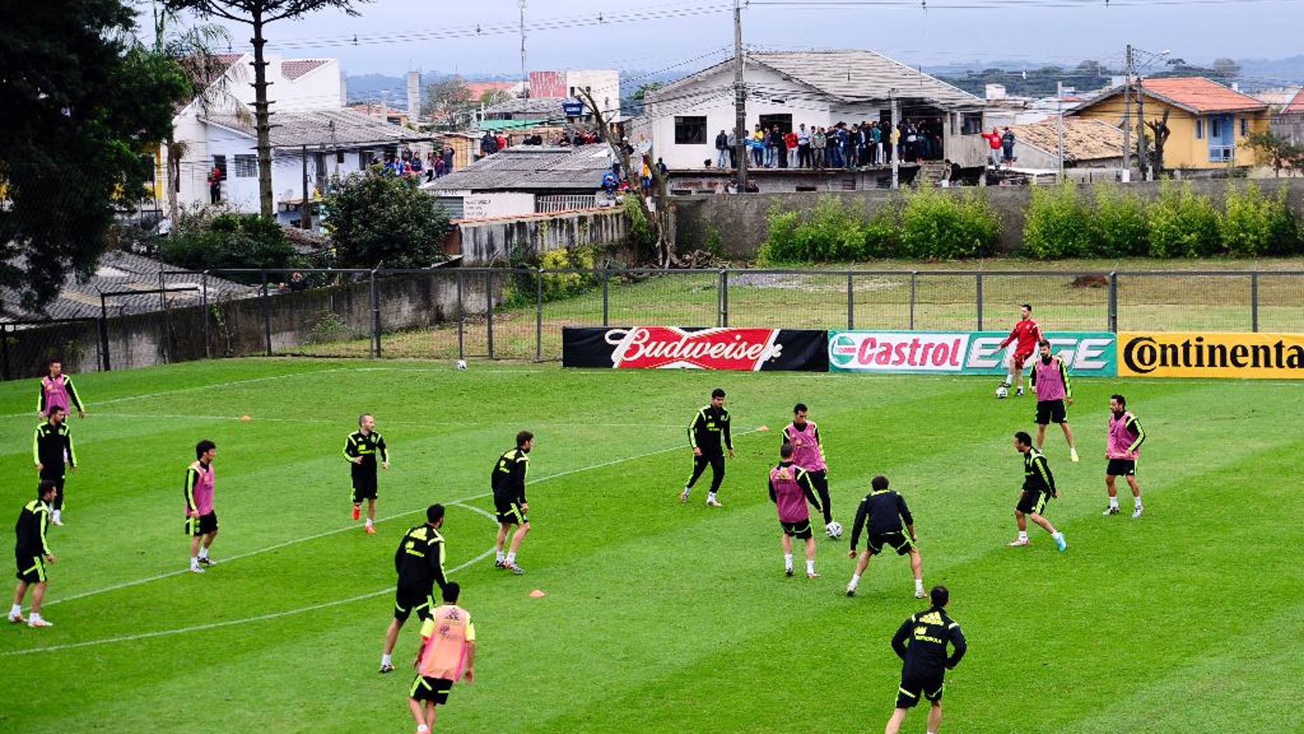 Spanish national team players attend a training session at the Atletico Paranaense training center in Curitiba, Brazil, Tuesday, June 10, 2014. Spain will play in group B of the Brazil 2014 World Cup. (AP Photo/Manu Fernandez)