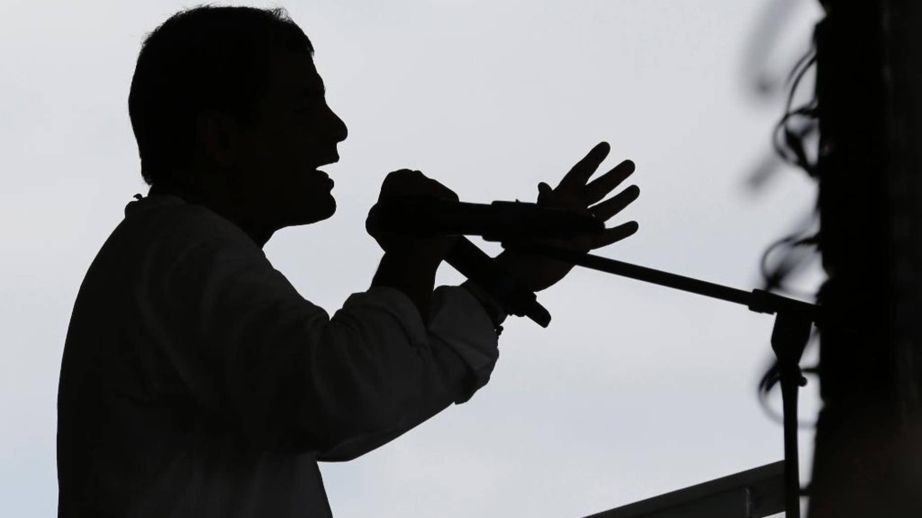 FILE - In this Jan. 16, 2014 file photo, Ecuador's President Rafael Correa speaks at the opening of the Comunidad del Milenio Panacocha in Ecuador's Amazon region. Far from laughing along with those who poke fun at him on social media, President Rafael Correa has created a website and Twitter account to marshal digital counterattacks by his supporters against the “defamers.” “For every lying tweet that they send out, we will send 10,000 that are truthful,” Correa said Saturday, Jan. 31, 2015 in his weekly TV appearance. (AP Photo/Dolores Ochoa, File)