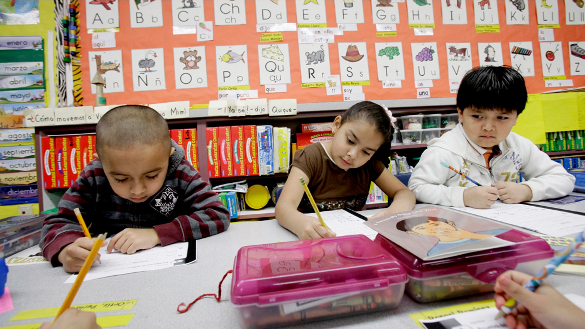 In this photo made Tuesday, Feb. 15, 2011, five-year-old kindergarden students Gael Alvarado, left, Perla Ortiz, center, and Yahir Perez do school work in a bilingual english-spanish class at Hanby Elementary School in Mesquite, Texas. Mesquite ISD, like many districts in Texas, has seen a demographic shift in the racial make up students over the past 10 years. Hispanics account for two-thirds of Texas' growth over the past decade and now make up 38 percent of the state's total population, according to new local U.S. Census figures released Thursday, Feb. 17, 2011. (AP Photo/LM Otero) (AP Photo/LM Otero)