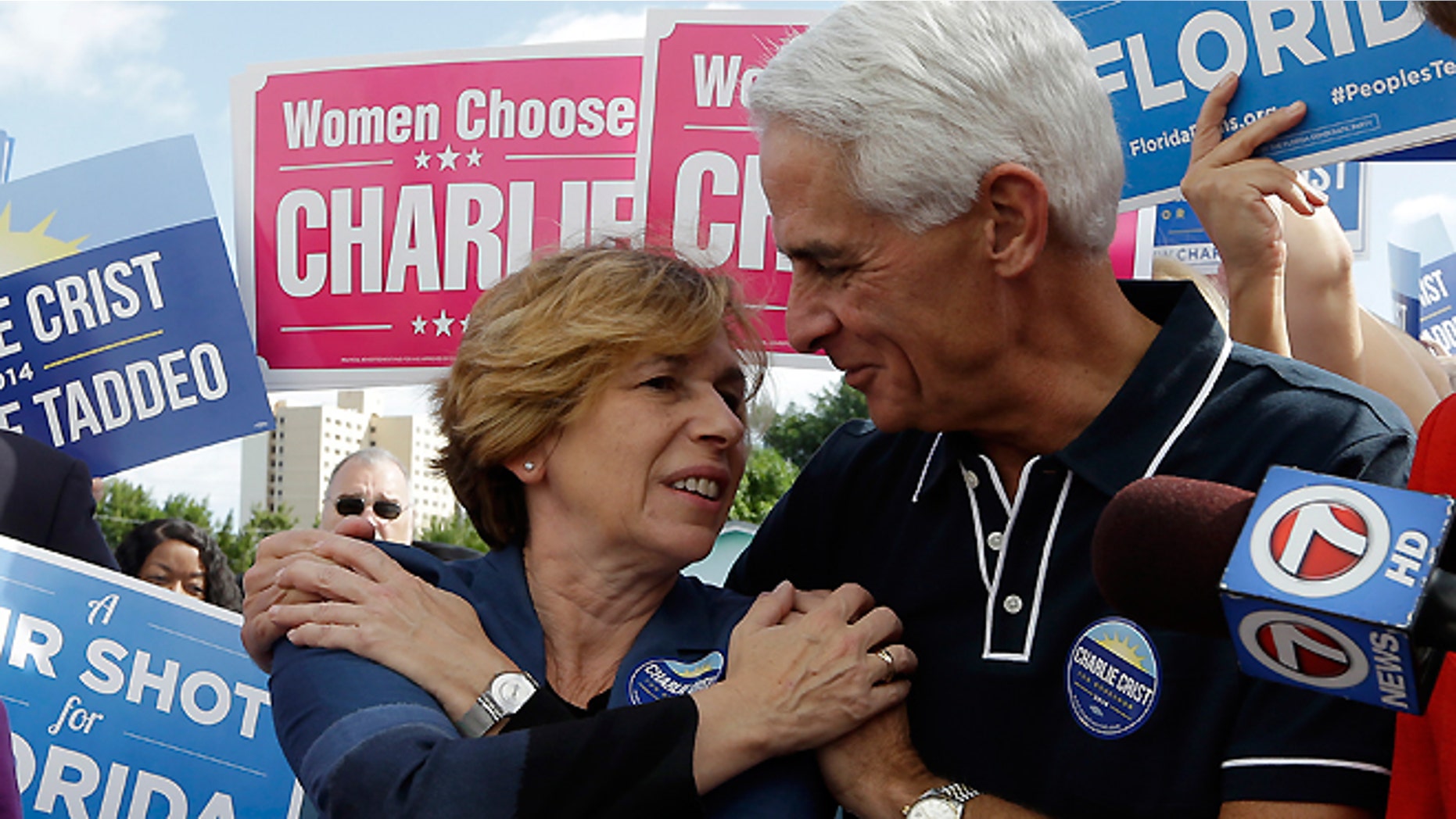 Nov. 3, 2014: Democratic gubernatorial candidate Charlie Crist, right, talks with Randi Weingarten, president of the American Federation of Teachers, left, as he campaigns at the International Brotherhood of Electrical Workers Hall, in Miami.