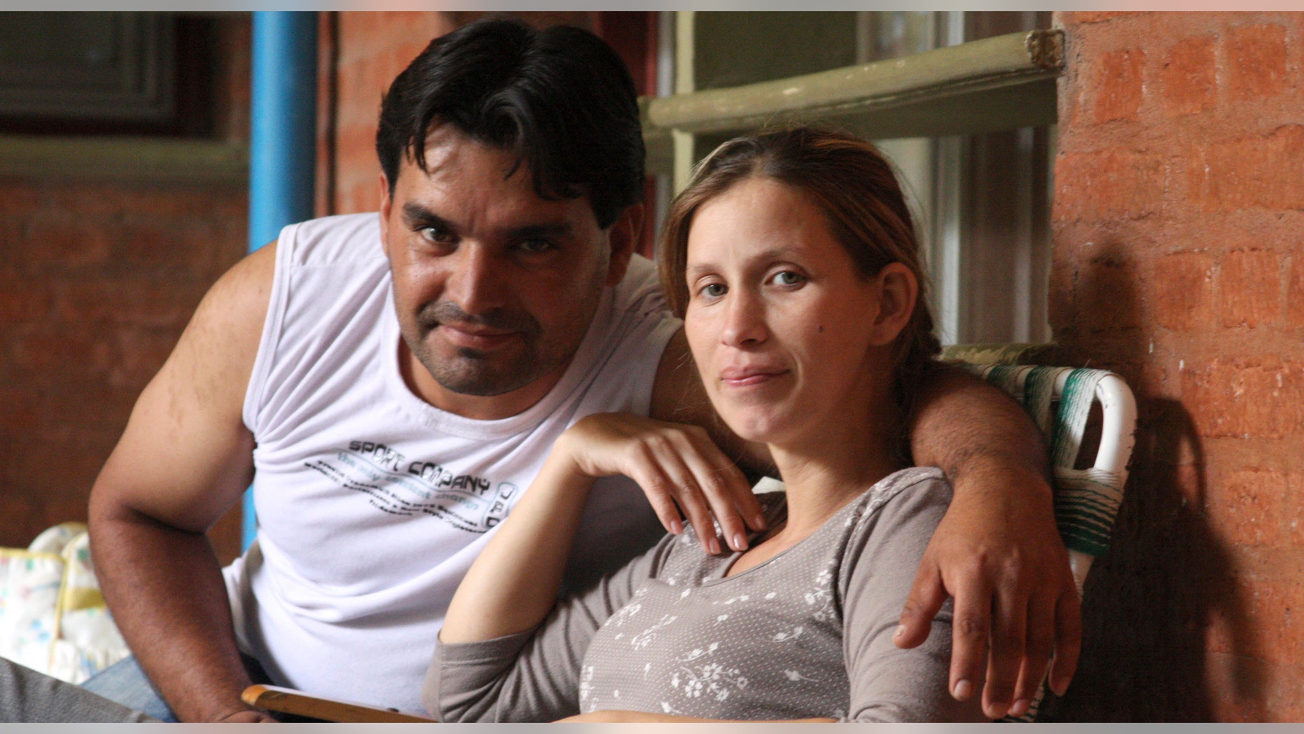 Analia Bouter and her husband Fabian Veron pose for a photo outside the hospital in Resistencia, Argentina, Wednesday April 11, 2012. (AP Photo/Juan Pablo Faccioli)