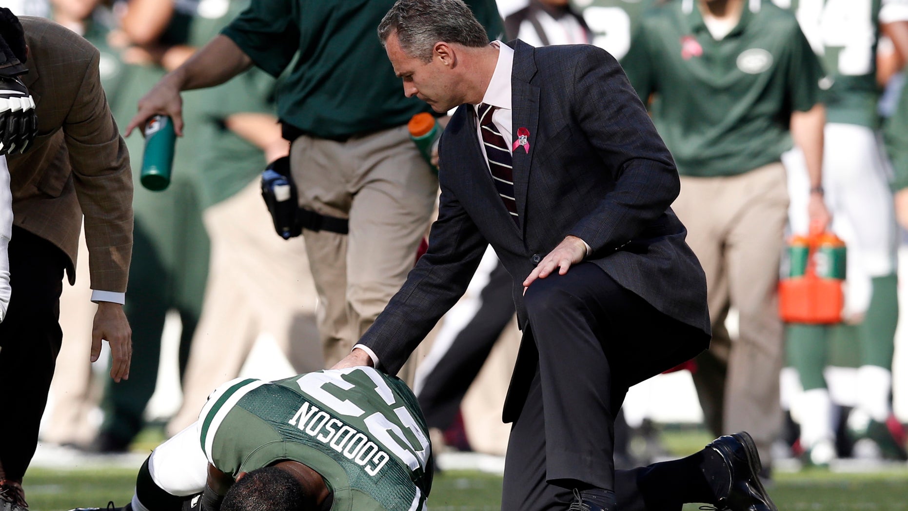 New York Jets' Mike Goodson (23) is tended to after being injured on a play during the second half of an NFL football game against the Pittsburgh Steelers, Sunday, Oct. 13, 2013, in East Rutherford, N.J. The Steelers won 19-6. (AP Photo/Kathy Willens)