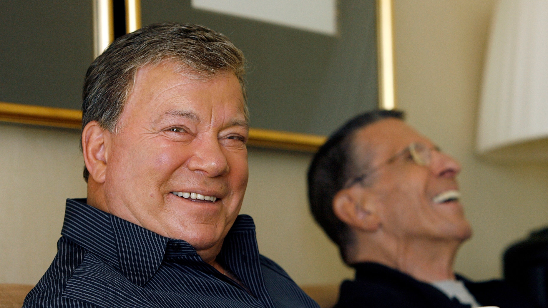 Actors William Shatner and Leonard Nimoy laugh during an interview for the 40th anniversary of the science-fiction television series 'Star Trek' in Los Angeles August 9, 2006.