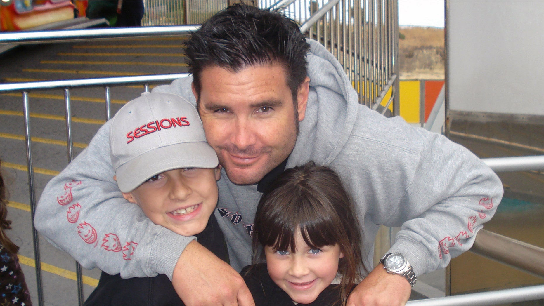 Undated photo of Bryan Stow holding his 12-year-old son and 8-year-old daughter.