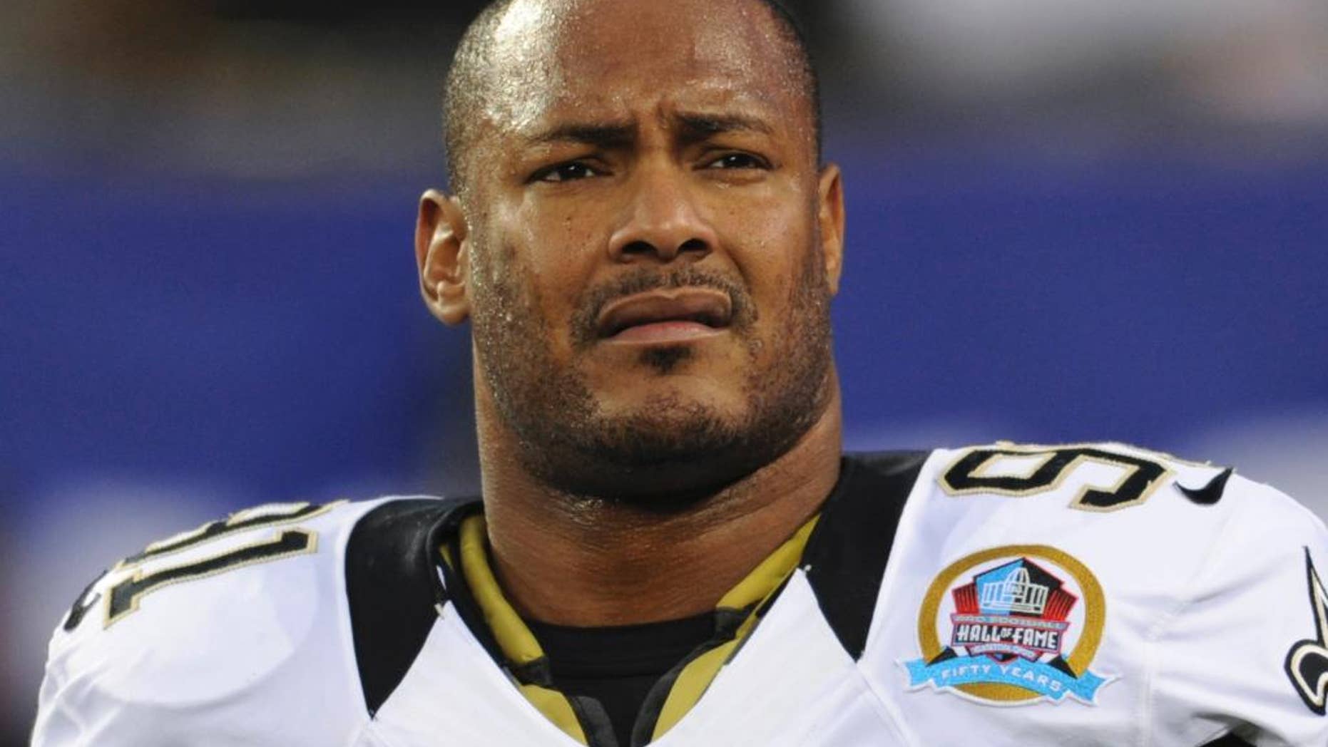 FILE - In this Dec. 9, 2012, file photo, New Orleans Saints defensive end Will Smith appears before an NFL football game against the New York Giants in East Rutherford, N.J. A judge in New Orleans postponed until Friday, July 22, 2016, a hearing on whether the New Orleans district attorney's office should be barred from prosecuting the man charged in the shooting death of Smith. (AP Photo/Bill Kostroun, File)