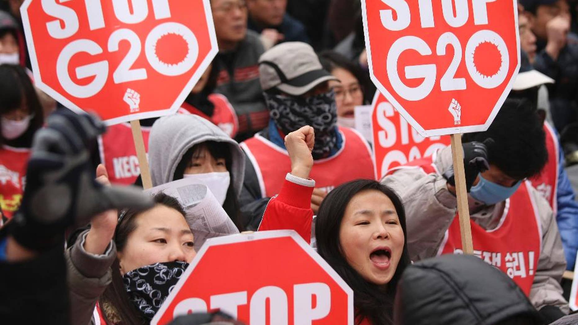 FILE - In this Thursday, Nov. 11, 2010 file photo, protesters gather to denounce the G-20 Summit. Since 2010, the G-20 has issued two-year action plans on anti-corruption efforts, and a report on what has been achieved under the last plan is expected at this weekend's summit. The leaders will also issue a new plan for 2015-16, which is expected to include commitments on issues such as foreign bribery, stolen asset recovery and whistleblower protection, said A.J. Brown, a director with Transparency International Australia. (AP Photo/Wally Santana, File)