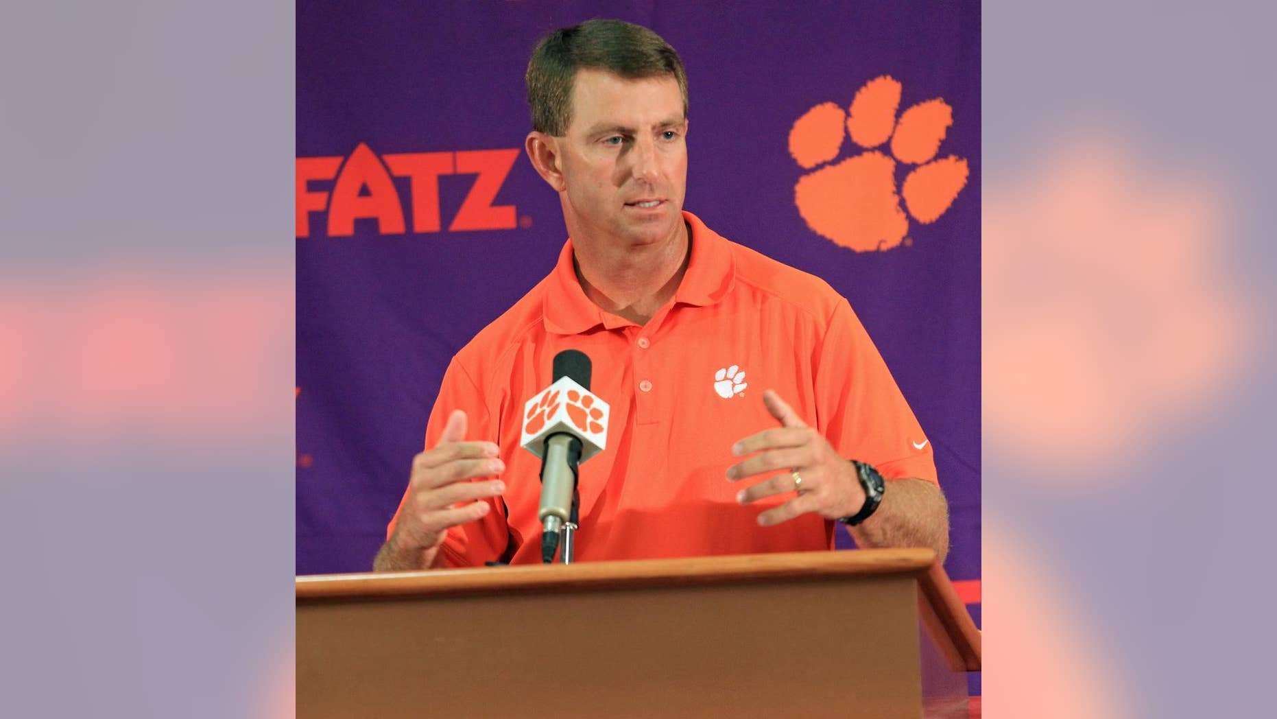 Clemson head coach Dabo Swinney discusses the Tigers' NCAA college football 2014 season at Memorial Stadium in Clemson, S.C. on Tuesday, Aug. 26, 2014. Clemson opens the season at Georgia on Aug. 30. (AP Photo/Anderson Independent-Mail, Mark Crammer)