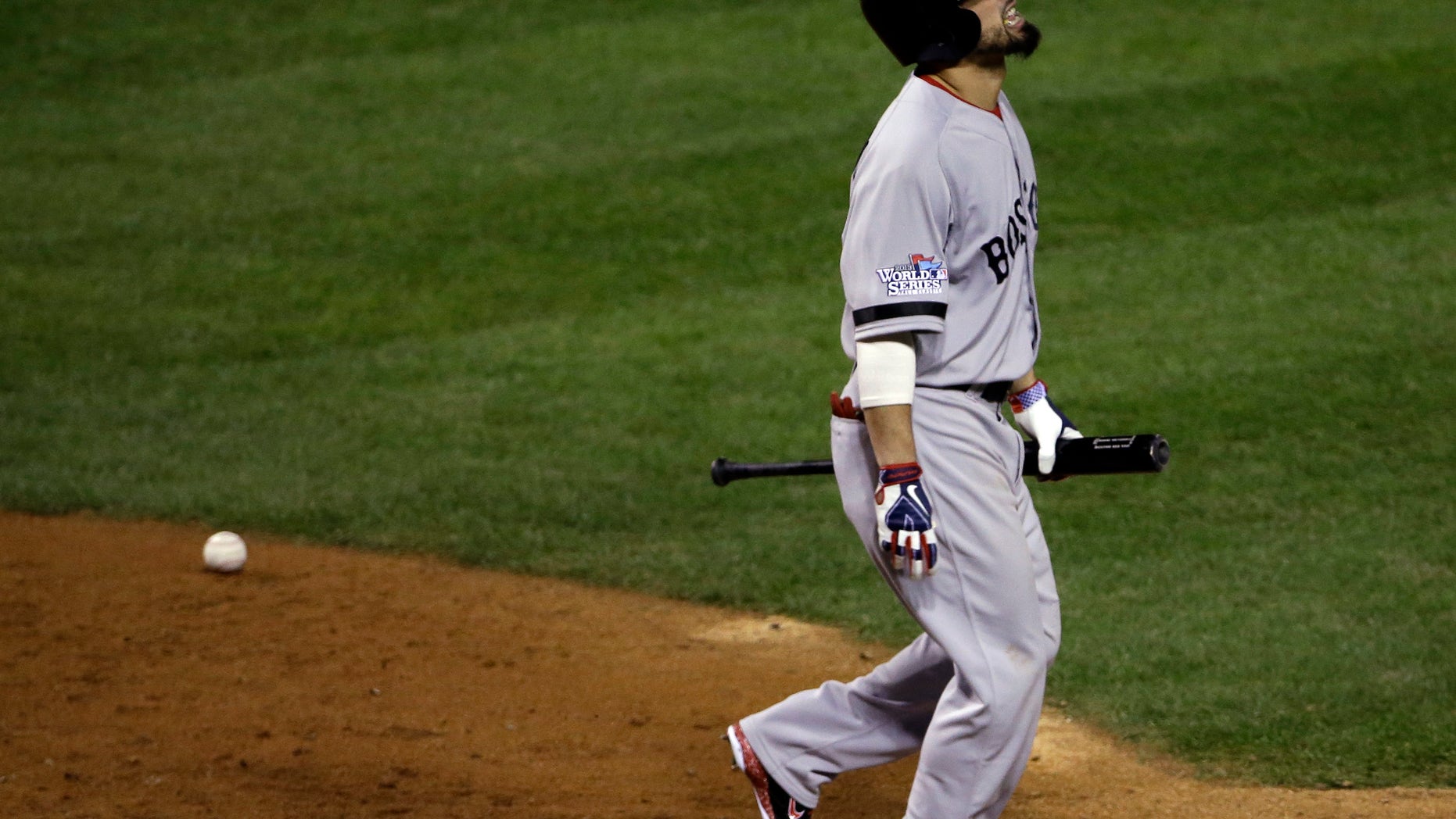 Boston Red Sox's Shane Victorino grimaces after being hit by a pitch during the eighth inning of Game 3 of baseball's World Series against the St. Louis Cardinals Saturday, Oct. 26, 2013, in St. Louis. (AP Photo/David J. Phillip)