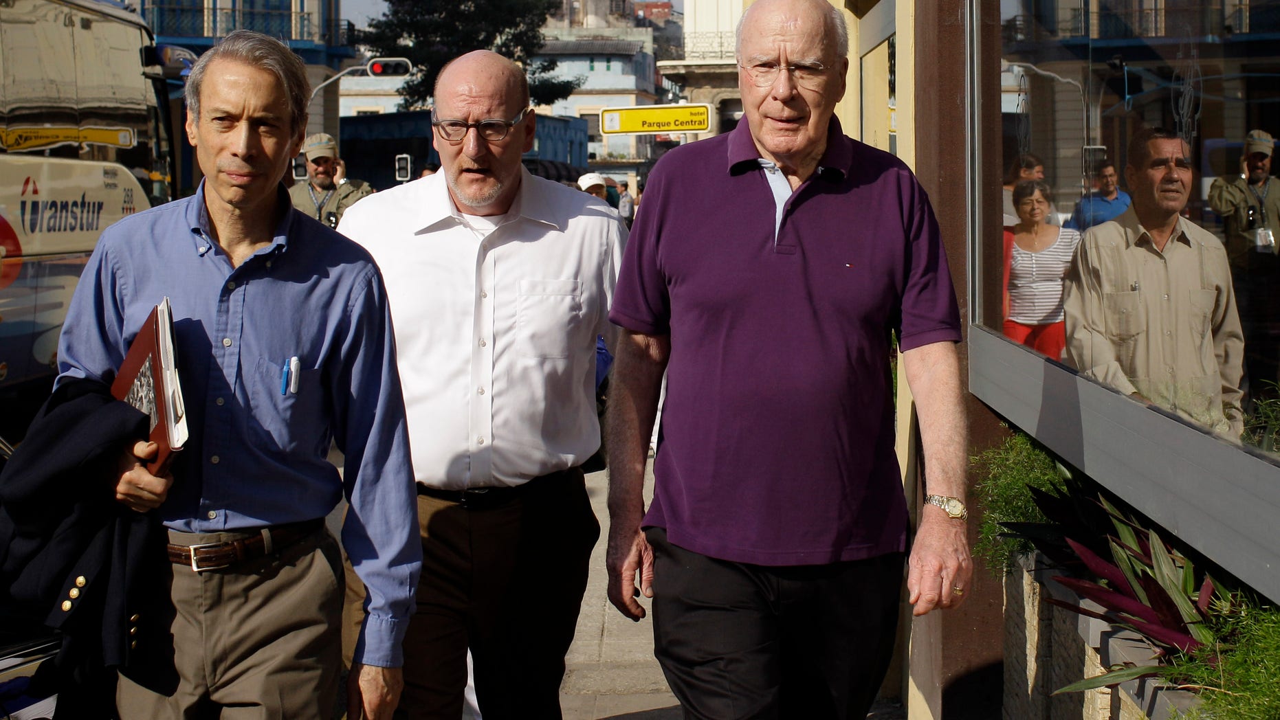 U.S. Sen. Patrick Leahy, right, arrives to the Hotel Parque Central along with two unidentified men in Havana, Cuba.