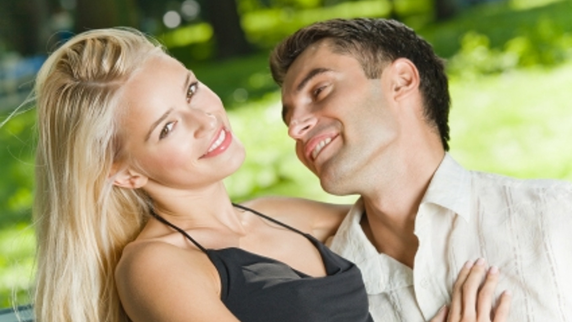 Young happy amorous couple together, outdoors