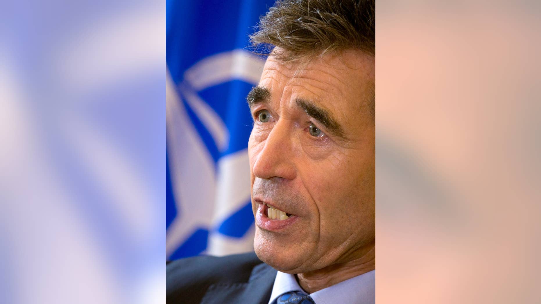 NATO Secretary General Anders Fogh Rasmussen speaks with the Associated Press during an interview at the Bibliotheque Solvay in Brussels on Monday, Sept. 15, 2014. In a farewell speech as NATO's top civilian official, Rasmussen said the alliance finds itself on the front lines of a geopolitical division between "tolerance and fanaticism," and "democracy and totalitarianism." Rasmussen's five-year term as NATO secretary general comes to a close at the end of the month. (AP Photo/Virginia Mayo)
