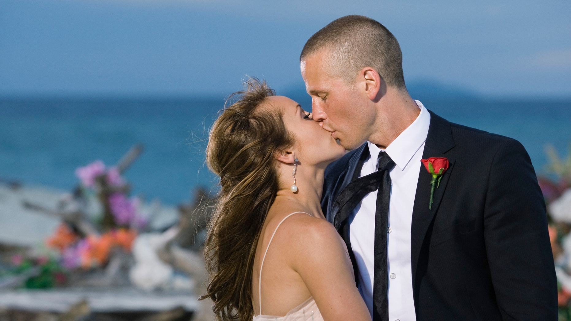 Ashley Hebert, left, kisses J.P. Rosenbaum on the season finale of "The Bachelorette" in Fiji.