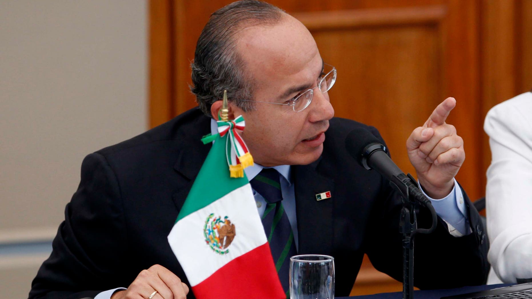 Mexico's President Felipe Calderon, gestures during a meeting with victims of violence in Mexico City, Thursday June 23, 2011. Calderon says he doesn't regret his strategy to fight organized crime, despite calls to end a confrontation that has killed at least 35,000 during his administration. (AP Photo/Eduardo Verdugo)