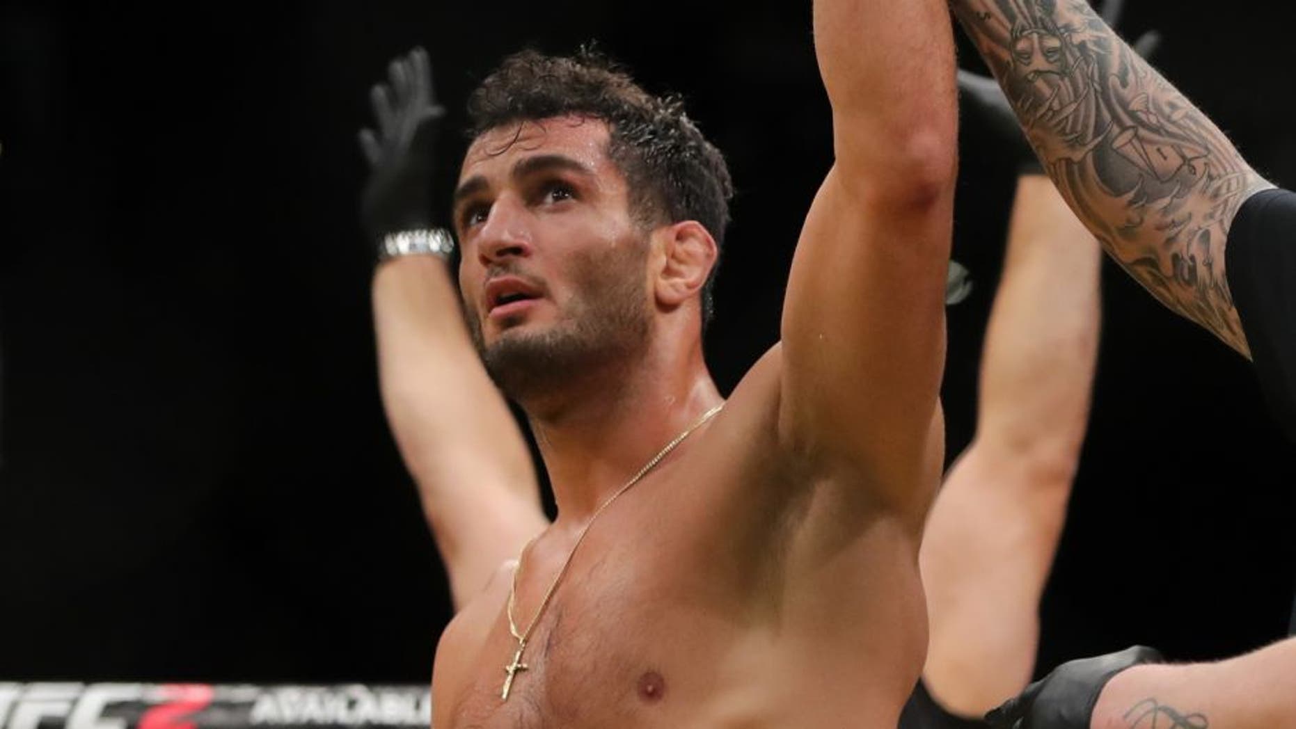 LAS VEGAS, NV - JULY 9: Gegard Mousasi celebrates his victory over Thiago Santos (L) during the UFC 200 event at T-Mobile Arena on July 9, 2016 in Las Vegas, Nevada. (Photo by Rey Del Rio/Getty Images)