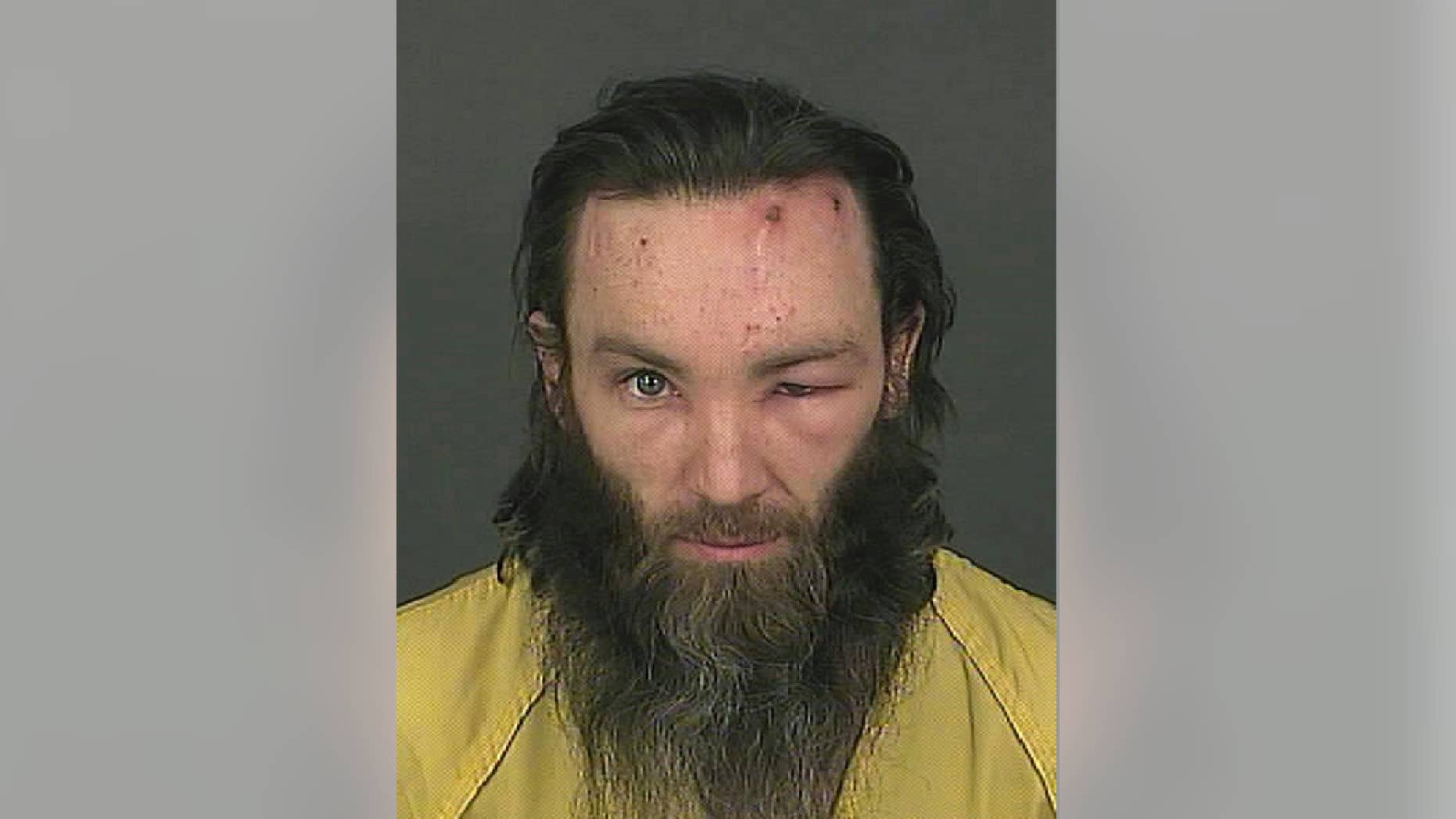 This booking photo released on Feb. 2, 2017 by the Denver Police Department shows homicide suspect Joshua A. Cummings in Denver. Cummings was arrested shortly after the point-blank shooting death of a transit guard in downtown Denver on Tuesday, Jan. 31, 2017. (Denver Police Department via AP)