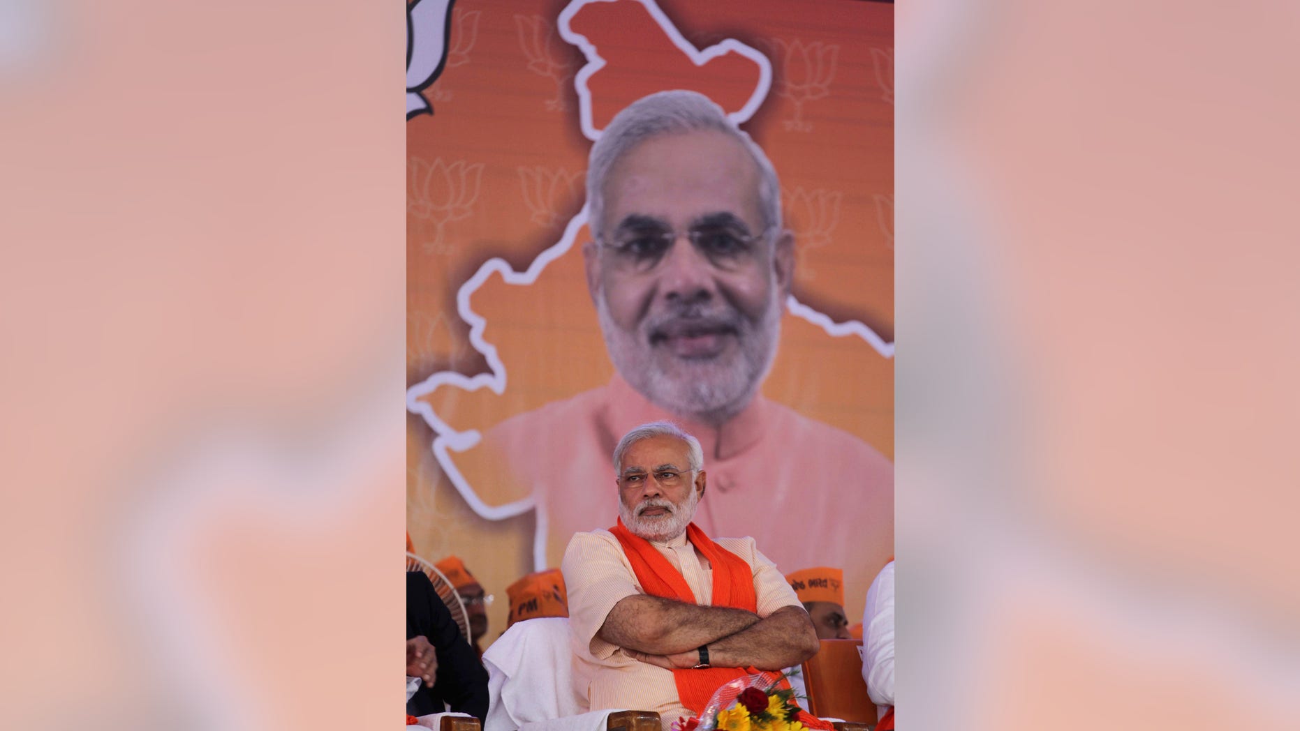 Gujarat state chief minister and Bharatiya Janata Party's prime ministerial candidate Narendra Modi sits during party workers' convention after inaugurating the party's new state headquarters building in Gandhinagar, India, Monday, Feb. 10, 2014. (AP Photo/Ajit Solanki)