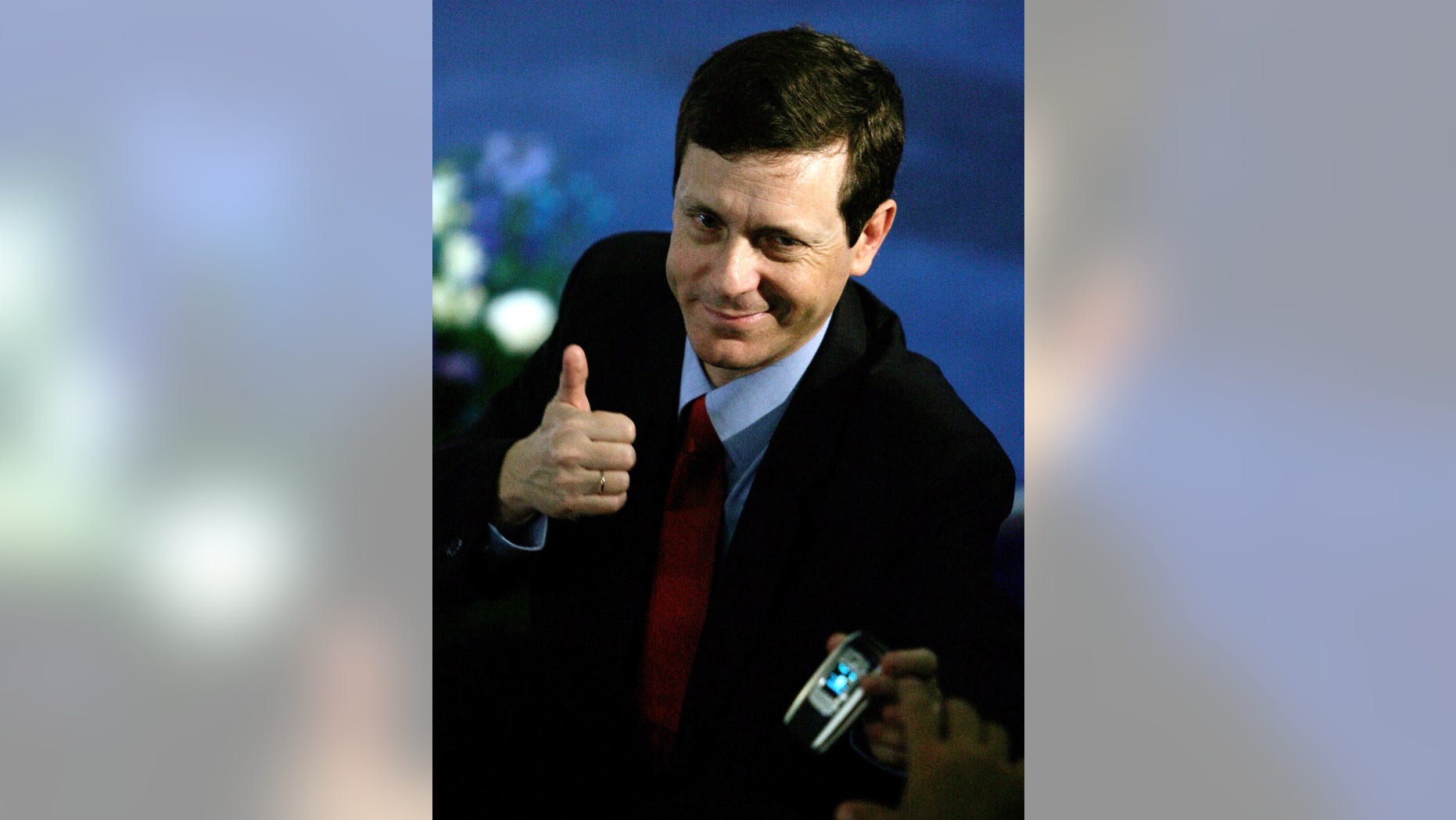 FILE - In this Jan. 18, 2006 file photograph, Israeli Isaac Herzog, a former cabinet minister, gestures after the primary results were announced during a convention in the community of Beit Berl in central Israel. Veteran lawmaker Herzog has unseated the incumbent Labor Party leader Shelly Yachimovich on Friday, Nov. 22, 2013, and will become Israel’s new opposition leader. (AP Photo/Ariel Schalit, File)
