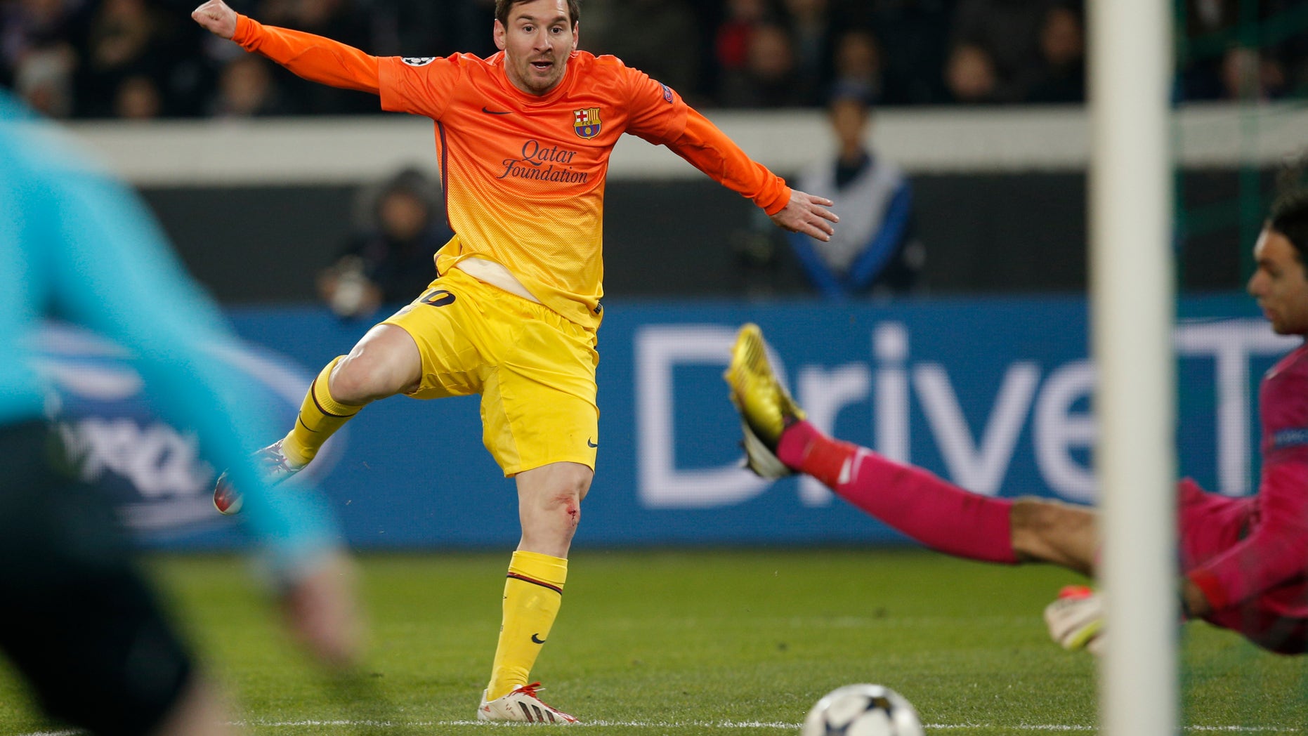 Barcelona's Lionel Messi scores the opening goal while Paris Saint Germain's goalkeeper Salvatore Sirigu of Italy looks on during their Champions League quarterfinal soccer match in Paris,Tuesday, April 2, 2013. (AP Photo/Christophe Ena)
