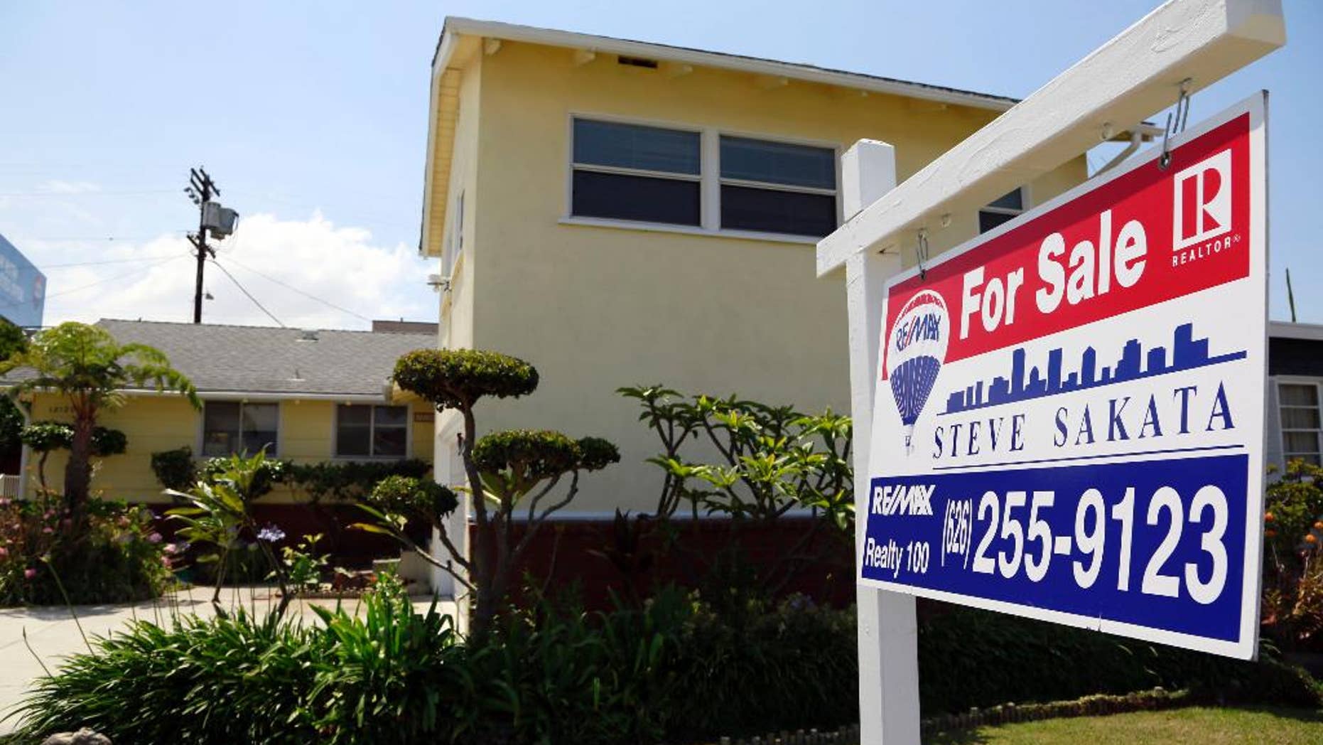 This Thursday, May 21, 2015 photo shows a house for sale in Culver City, Calif. Freddie Mac reports on average U.S. mortgage rates on Thursday, May 28, 2015. (AP Photo/Nick Ut)
