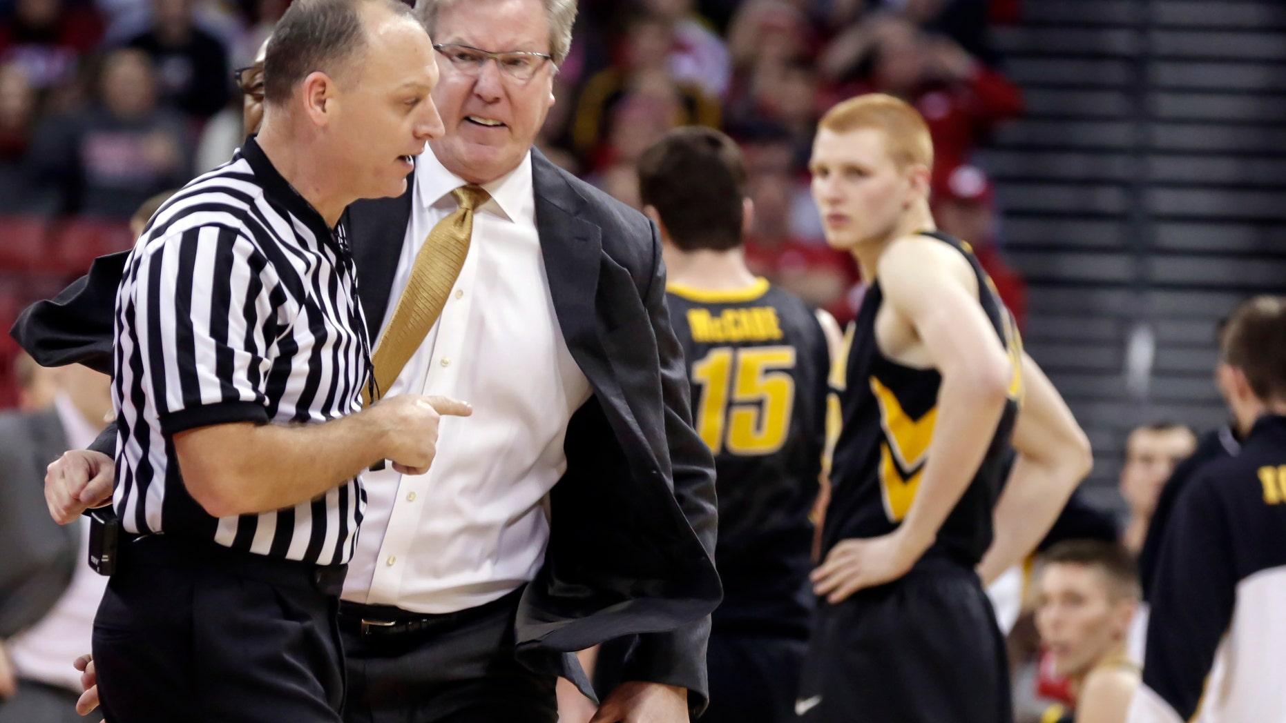 Iowa coach Fran McCaffery, second from left, argues a call during the second half of an NCAA college basketball game against Wisconsin, Sunday, Jan. 5, 2014, in Madison, Wis. McCaffery was ejected from the game and Iowa was charged with two technical fouls. Wisconsin won 75-71. (AP Photo/Andy Manis)