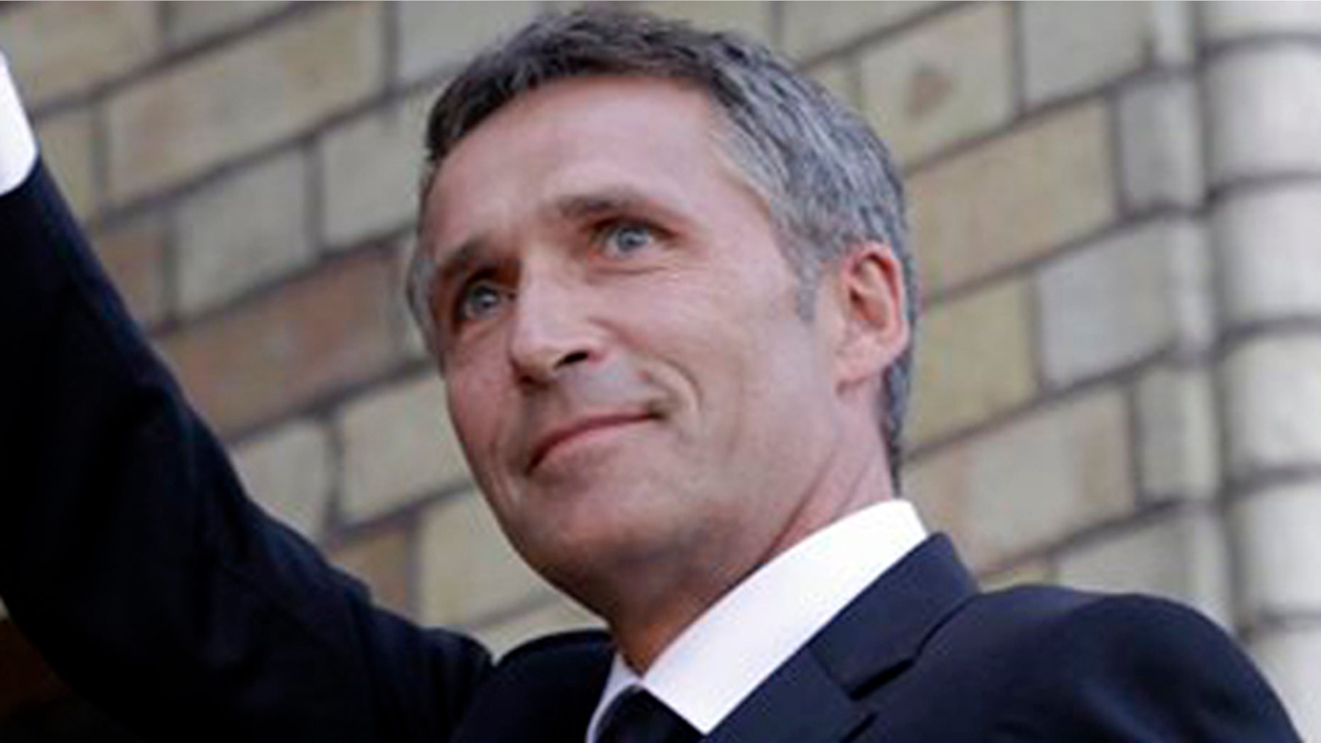 Norway's Prime Minister Jens Stoltenberg waves to supporters as he arrives for a memorial to honor the victims of the July 22 bombing and shooting massacre, at the parliament in Oslo, Monday, Aug. 1, 2011.