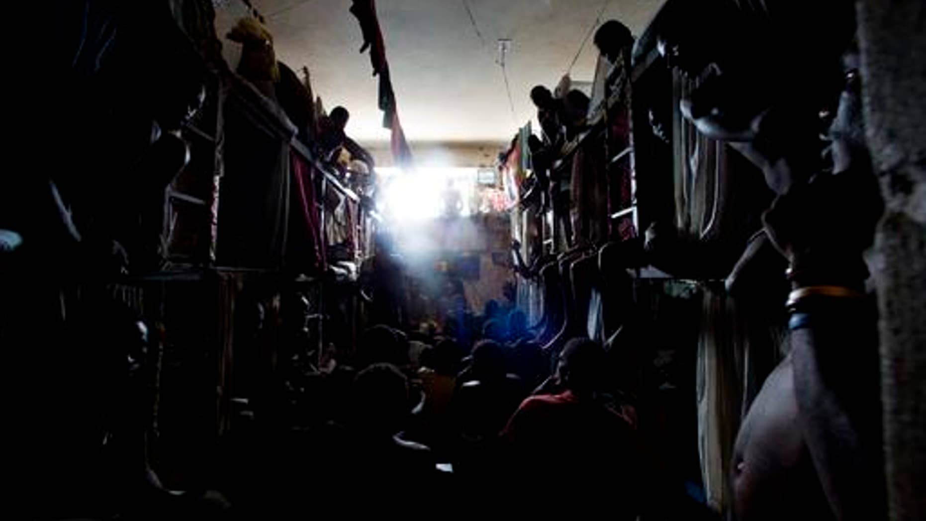 Prisoners rest in makeshift hammocks inside the National Penitentiary in downtown Port-au-Prince, Haiti.