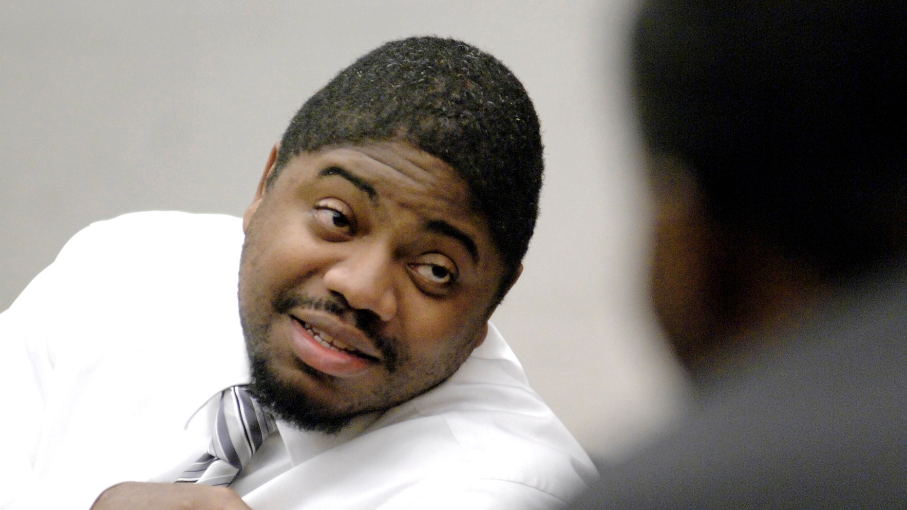 FILE - In an Oct. 28, 2008 file photo, defendant Michael Addison talks with a member of the gallery during a break in his capital murder trial in the death of Manchester Police Officer Michael Briggs, in Hillsborough County Superior Court in Manchester, N.H. Addison was sentenced to death in 2008 for Briggs' murder. On Wednesday, Nov. 6, 2013, New Hampshire’s Supreme Court will rule on the constitutionality of the state’s death penalty and whether the death sentence of Addison will stand. (AP Photo/Union Leader, Bob LaPree, Pool, File)