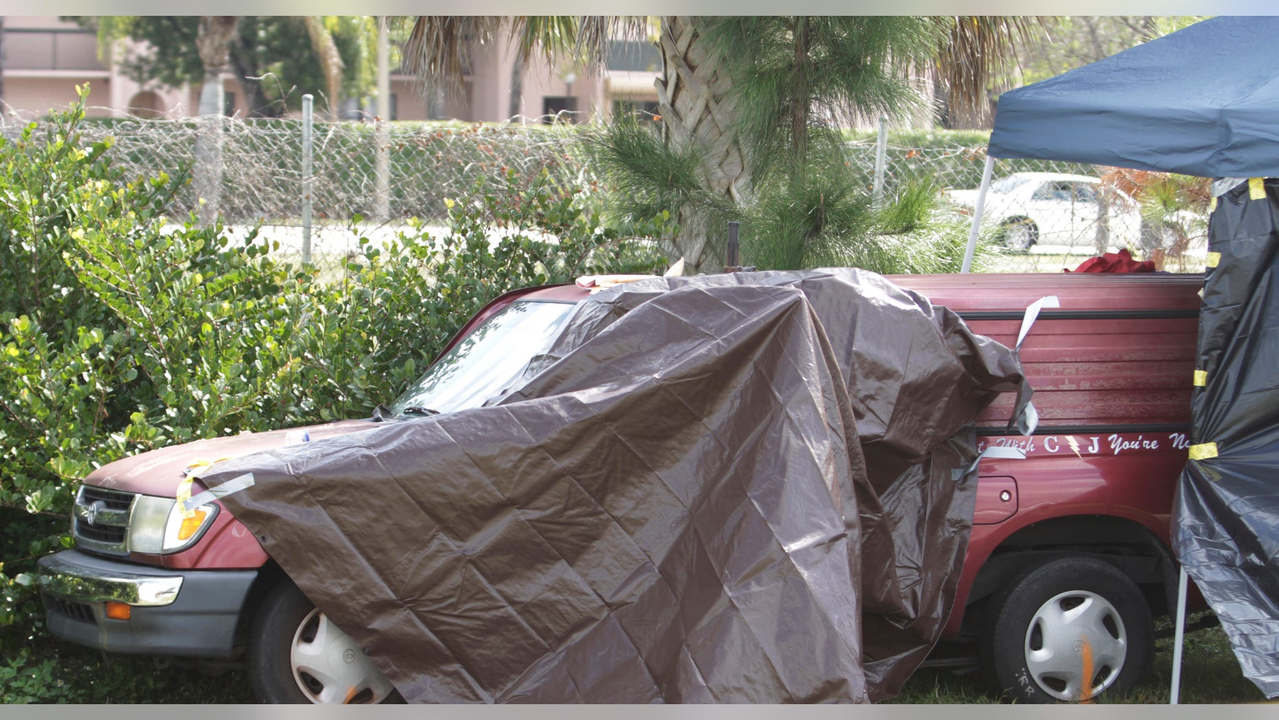 Feb. 16: A truck, covered by police, is parked on the side of I-95 near West Palm Beach, Fla., after officials discovered it was filled with toxic chemicals, a 10-year-old girl's dead body, and her severely injured twin brother.
