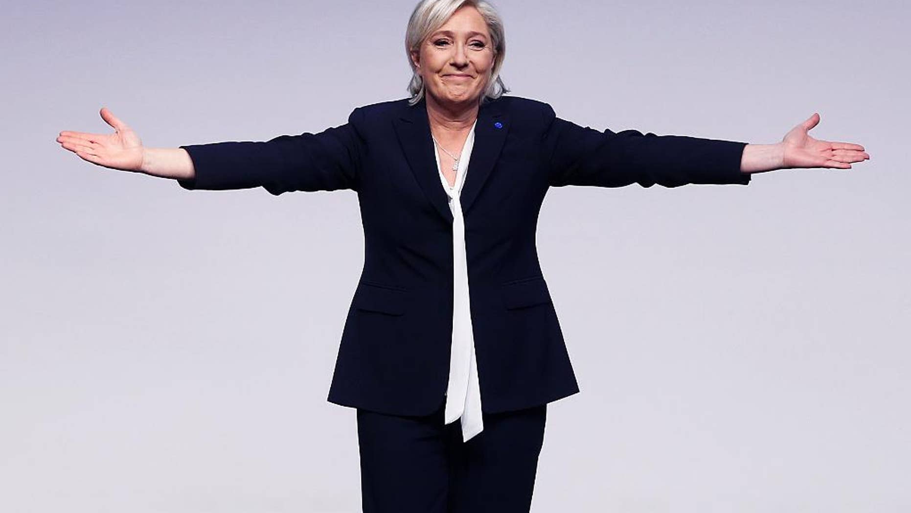 FILE - In this file photo dated Saturday, Jan. 21, 2017, Far-right leader and candidate for next spring presidential elections Marine le Pen from France celebrates after her speech at a meeting of European Nationalists in Koblenz, Germany. Le Pen is scheduled to give a speech to supporters at the congress center in Lyon, France, on Sunday Feb. 5, 2017, the second day of a conference by her anti-immigration National Front party. (AP Photo/Michael Probst, FILE)