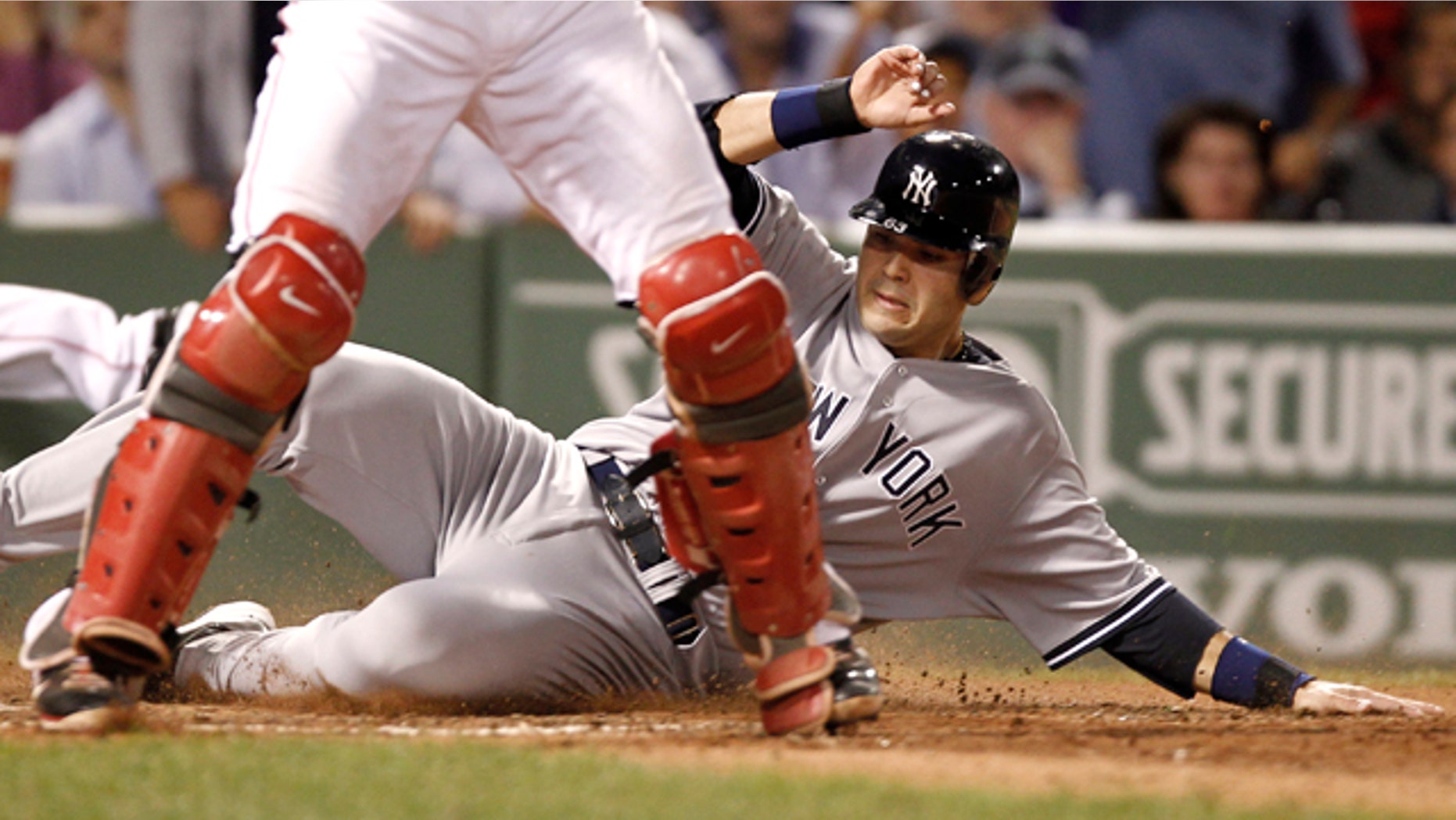 Sept. 1: New York Yankees' Jesus Montero slides home safely behind Boston Red Sox catcher Jarrod Saltalamacchia on a double by Russell Martin during the seventh inning of a baseball game at Fenway Park in Boston. (AP Photo/Winslow Townson)