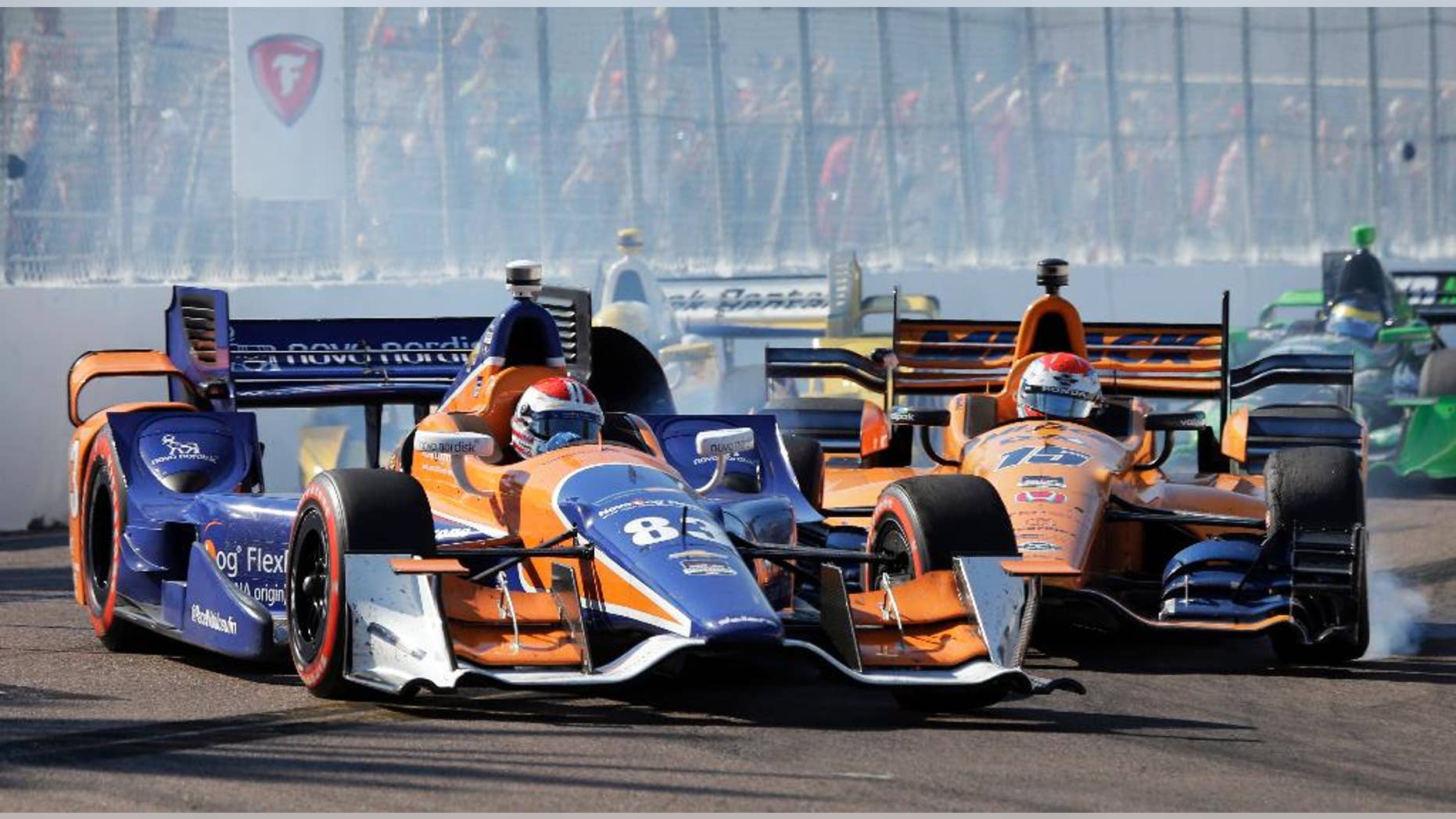 Charlie Kimball (83) gets hit by Graham Rahal while driving into Turn 10 during the IndyCar Firestone Grand Prix of St. Petersburg auto race Sunday, March 29, 2015, in St. Petersburg, Fla. (AP Photo/Chris O'Meara)