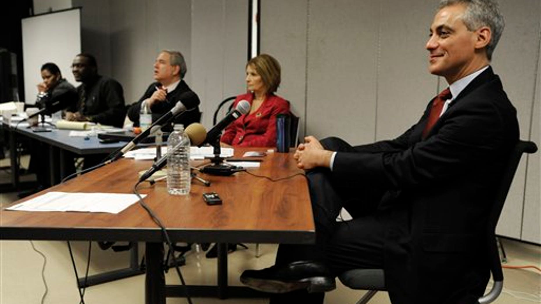 FILE - In this Dec. 14, 2010, file photo Rahm Emanuel, right, testifies before the Chicago Board of Election Commissioners during a hearing challenging his residency to run as Mayor in Chicago. The Board of Election commissioners will meet Thusday, Dec. 23, 2010, as they decide wheather Emanuel will be allowed to run for mayor. (AP Photo/Paul Beaty, file)