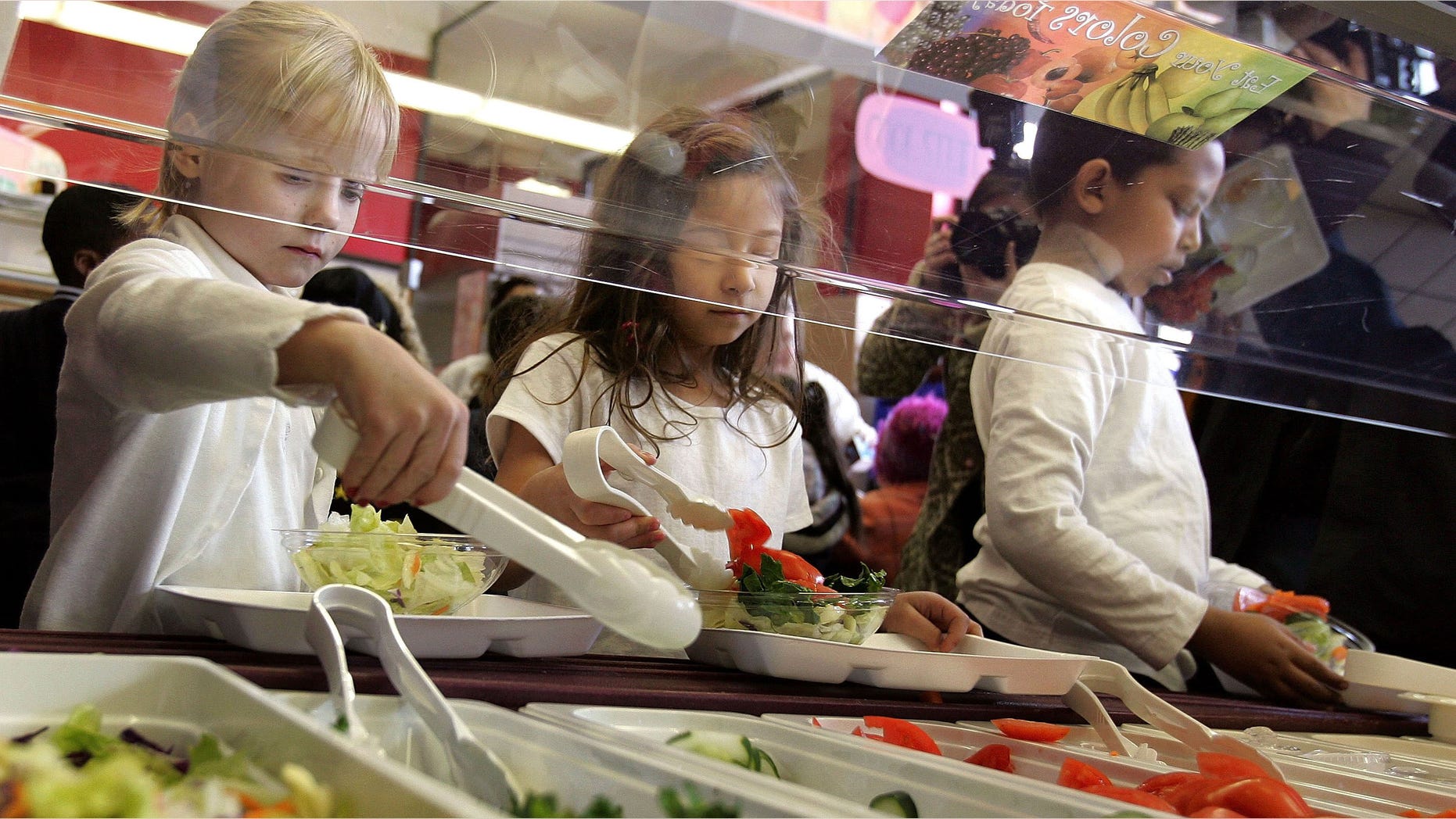 CHICAGO - MARCH 20: Students at Nettelhorst Elementary School, on lunch, dig into a salad bar in the school's lunchroom March 20, 2006 in Chicago, Illinois. U.S. Senator Dick Durbin (D-IL) stopped by the school to visit the new lunch program called, "Cool Foods," as part of the Healthy Schools Campaign. Nettelhorst is one of three Chicago public schools participating in the new lunch program offering salad bars. (Photo by Tim Boyle/Getty Images)