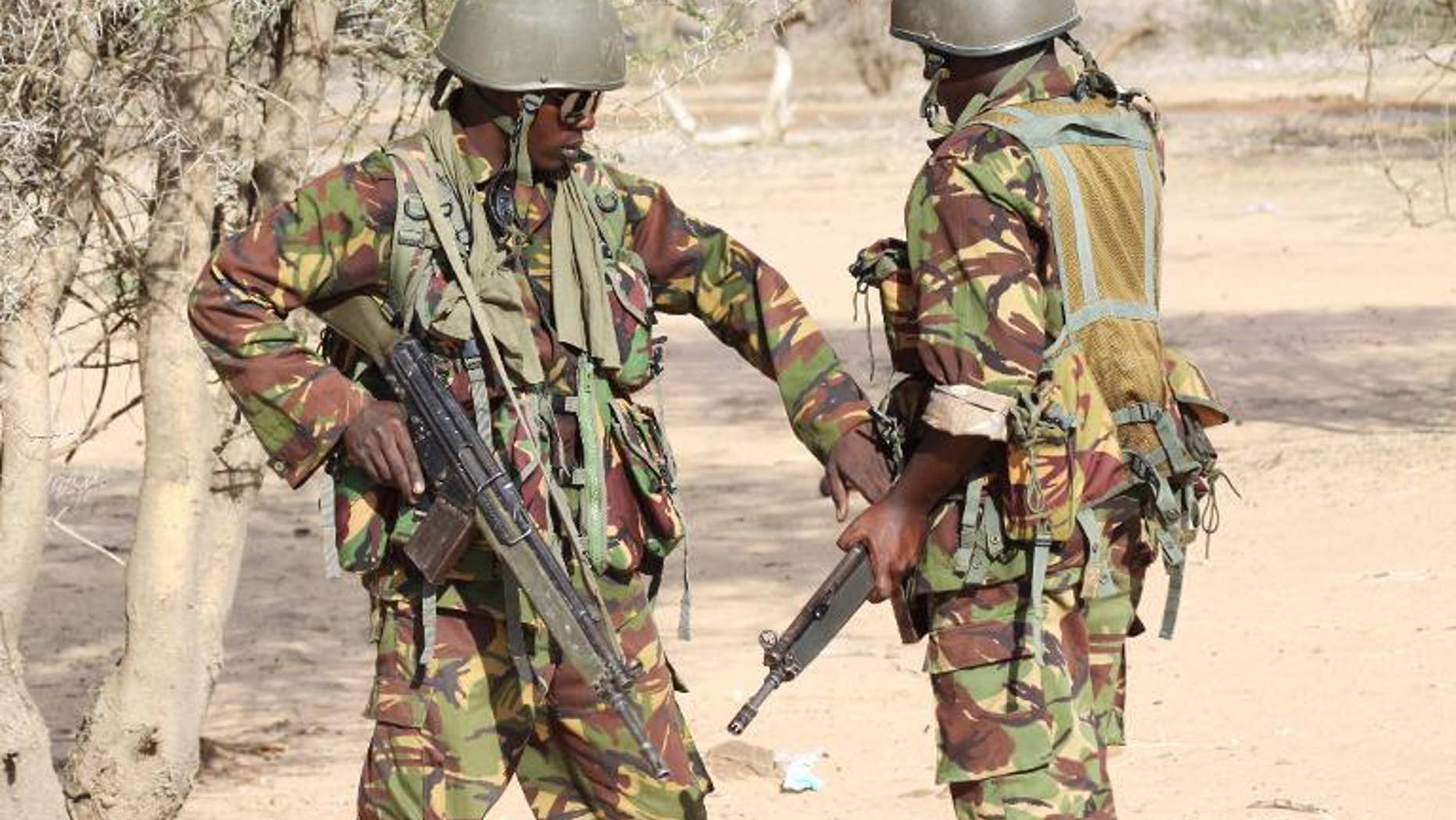 Kenyan soldiers guard a checkpoint near the border with Somalia, on October 18, 2011