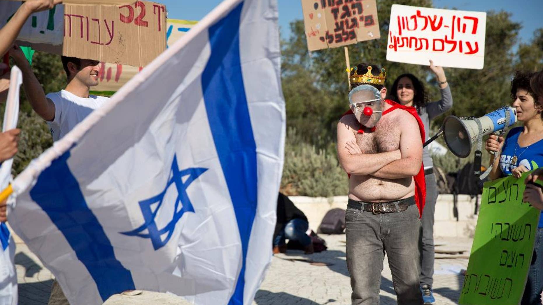 File - In this Sunday, Feb. 14, 2016 file photo, an activist wears a mask bearing a portrait of Prime Minister Benjamin Netanyahu during a protest against a natural gas deal signed in December, 2015 with U.S. and Israeli developers for drilling offshore gas deposits, in front of the Supreme Court in Jerusalem. Israel's Supreme Court has ruled against the governments framework deal for its natural gas reserves granting a year for issues to be worked out on Sunday, March 27, 2016. (AP Photo/Ariel Schalit, File)