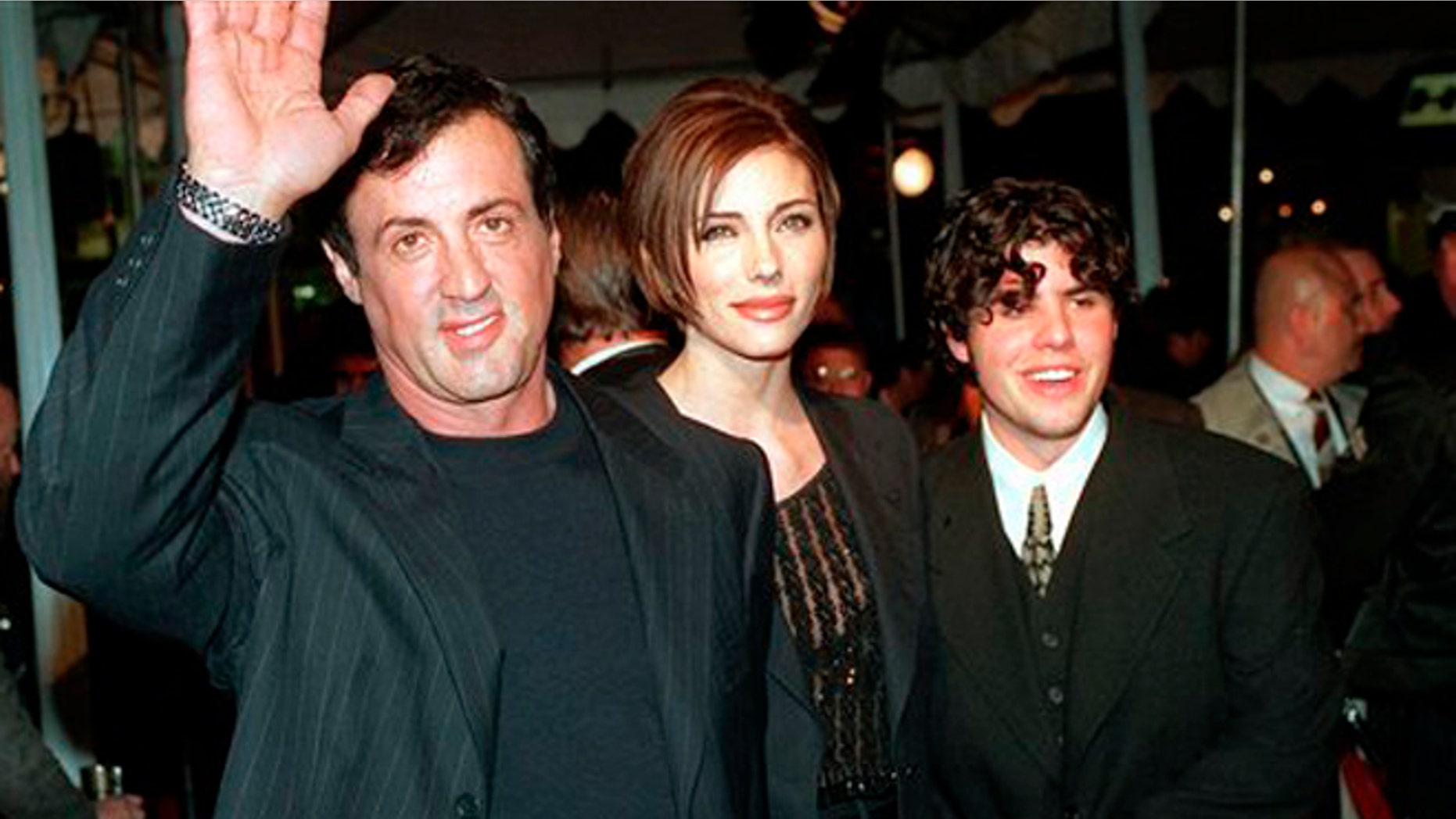 Dec. 5, 1996: In this file photo, Sylvester Stallone, left, star of the film "Daylight," arrives at the film's world premiere with his girlfriend Jennifer Flavin, center, and his son Sage Stallone, who co-stars in the film, in Hollywood district of Los Angeles.