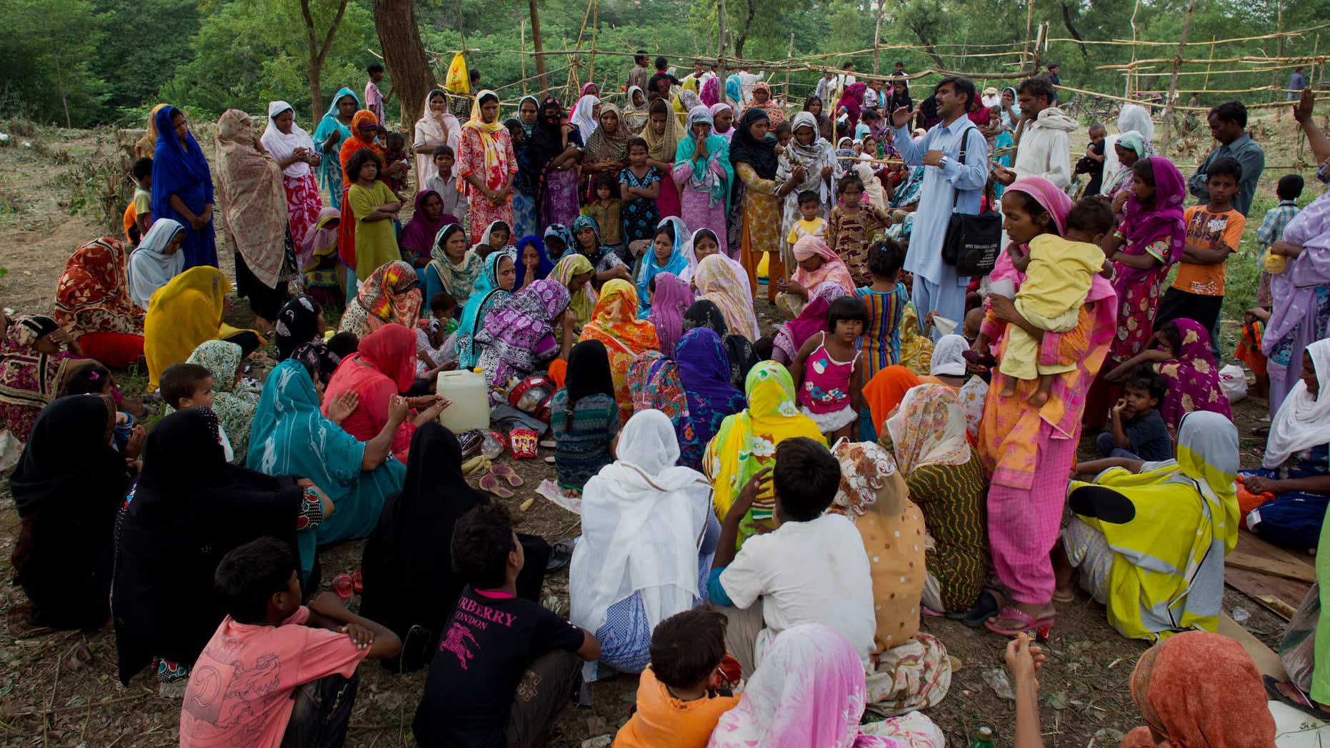 Aug. 27, 2012 - Pakistani Christians from a neighborhood where a girl was arrested on alleged blasphemy charges pray in a clearing of an urban forest in Islamabad, Pakistan.